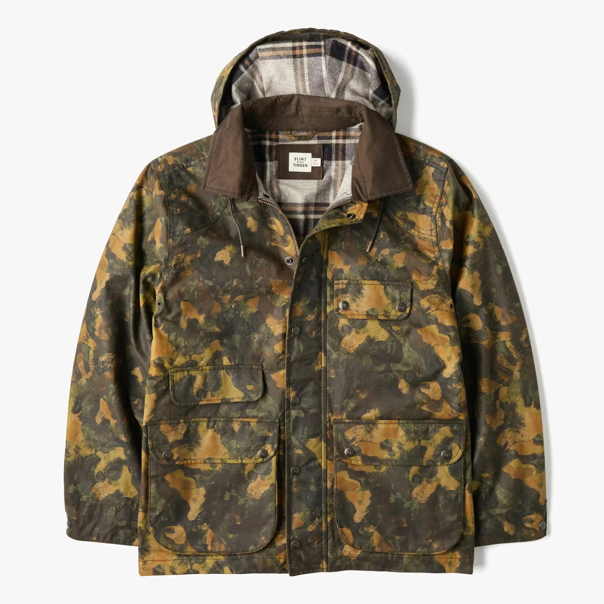 Camouflage-patterned hooded jacket with brown collar and plaid lining, featuring multiple front pockets and snap buttons.