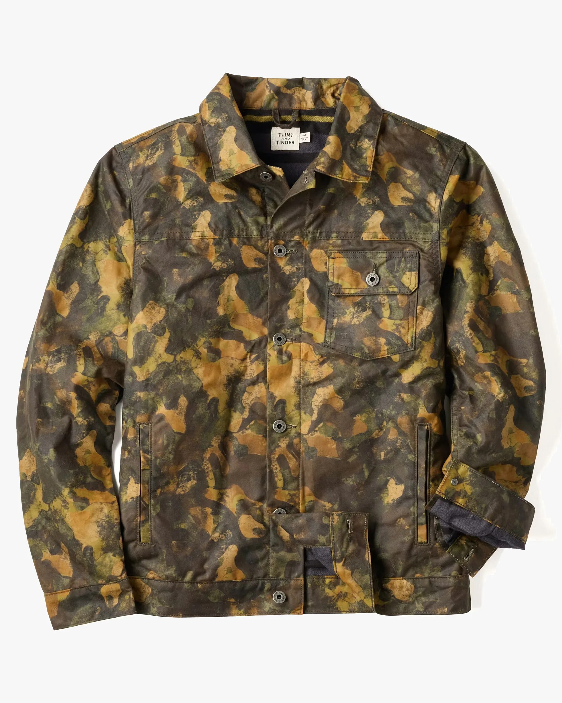 Camouflage-patterned button-up jacket with chest pocket and side pockets, partially unbuttoned cuff.