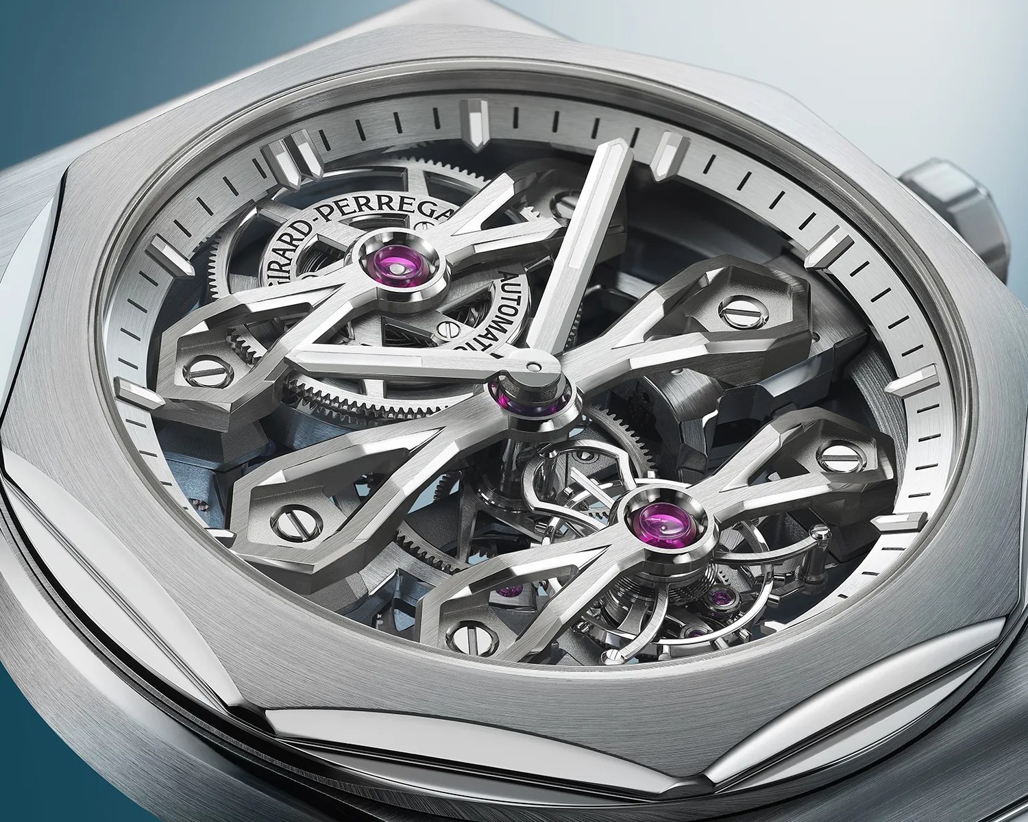 Close-up of a silver Girard-Perregaux skeleton watch with visible gears and purple jewel bearings.
