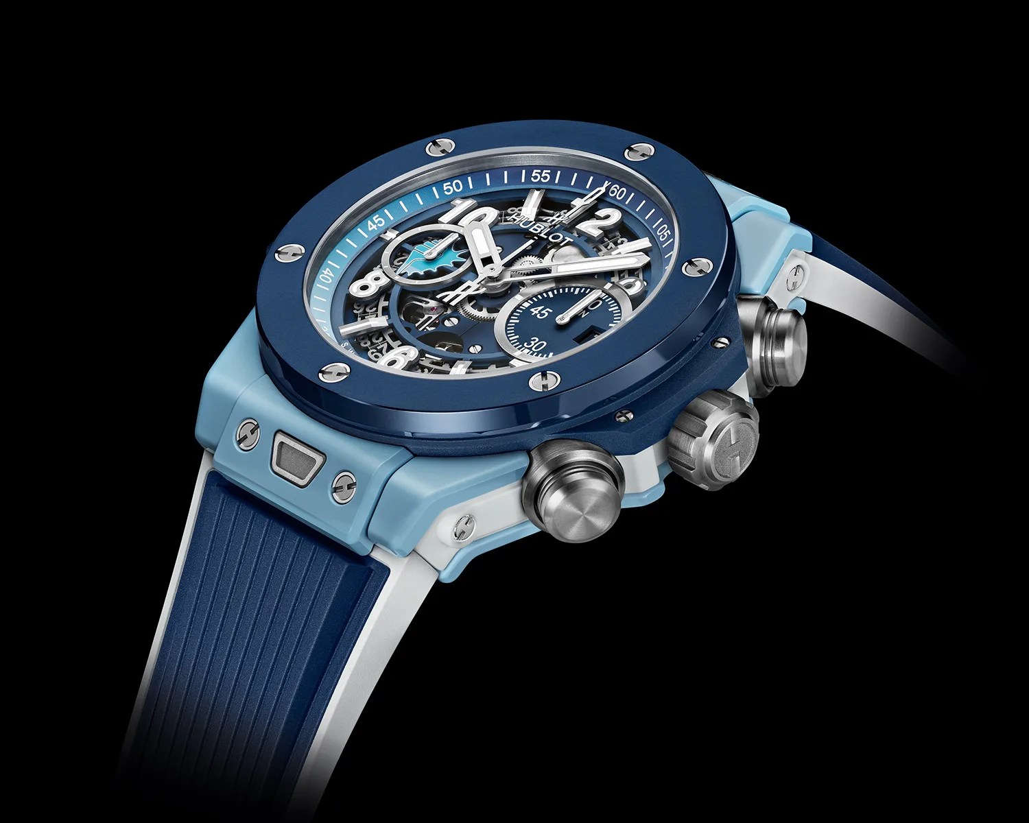 Blue and light blue Hublot wristwatch with a skeleton dial and rubber strap on a black background.