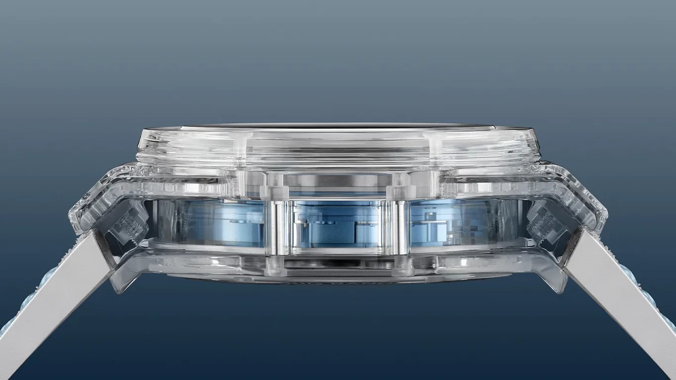Side view of a transparent watch case with visible internal blue components and white straps.