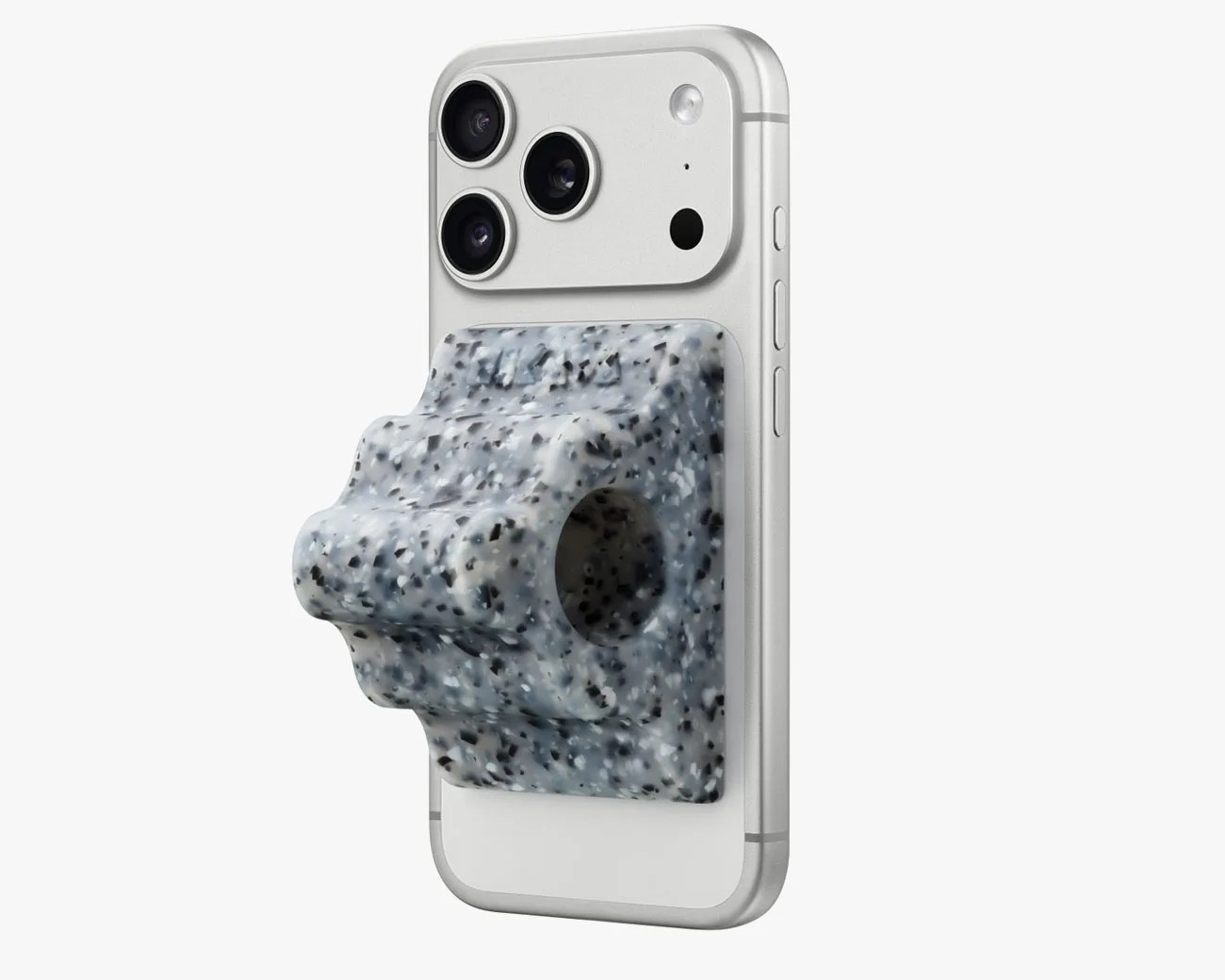 White smartphone with triple camera and a speckled gray-blue textured grip accessory attached to the back.