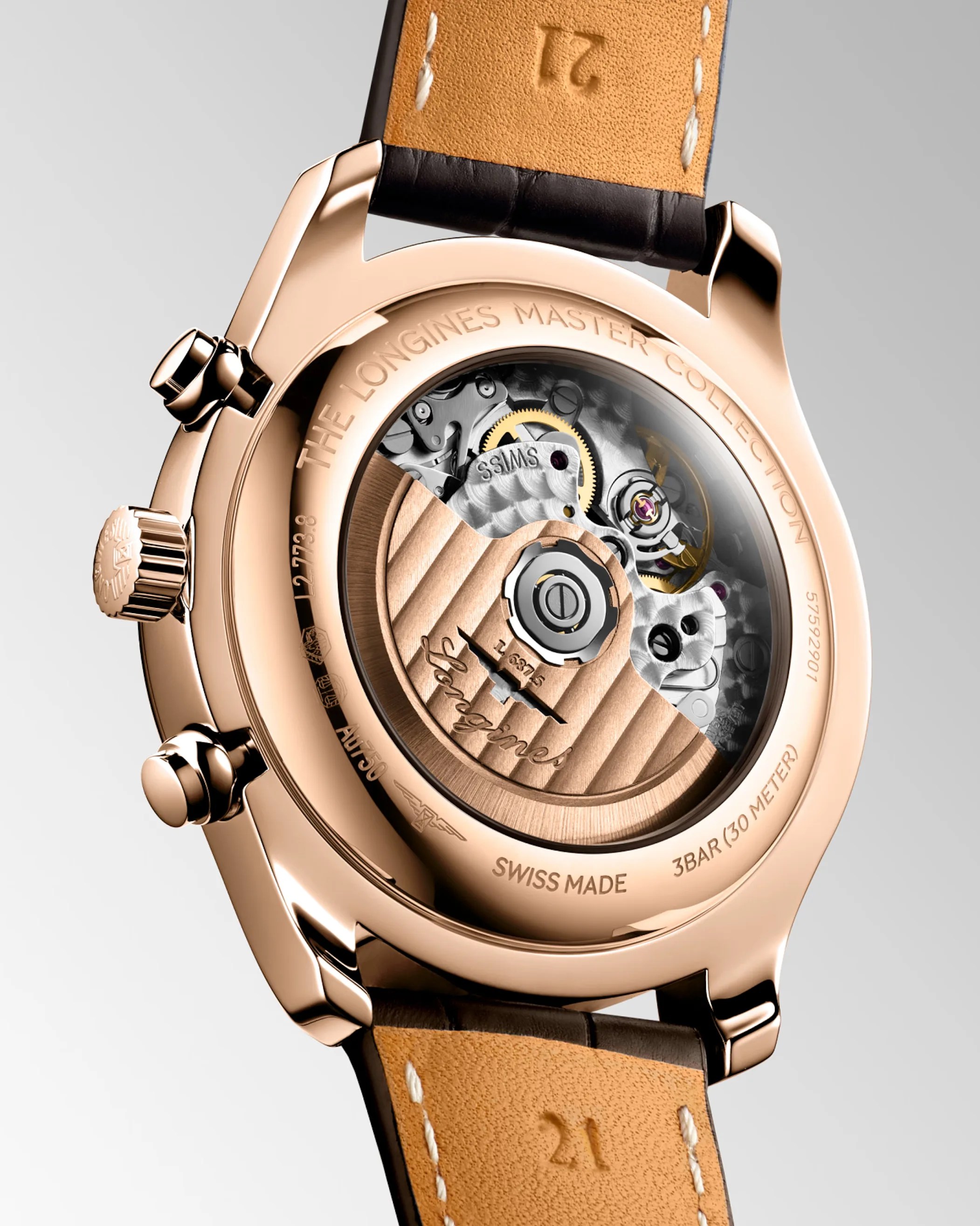 Rose gold Longines Master Collection watch back showing mechanical movement through transparent case and brown leather strap.