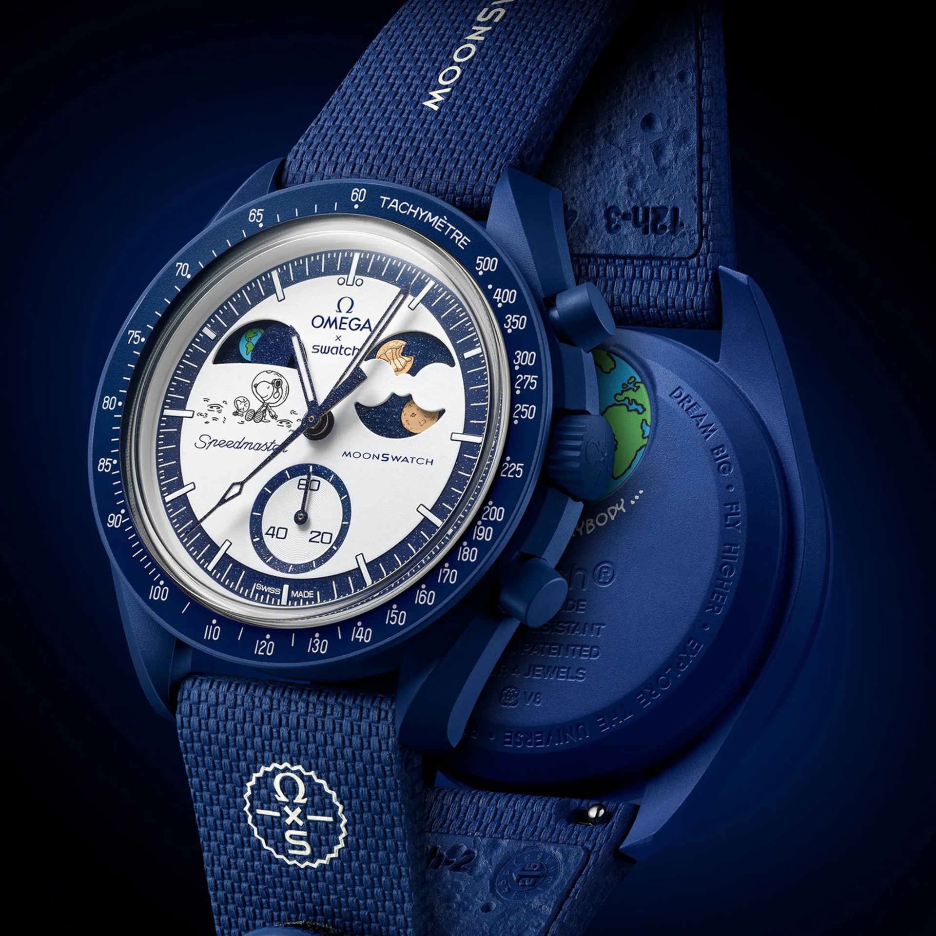 Blue Omega x Swatch Moonswatch with white dial featuring Snoopy and moon phase design, blue textured strap.