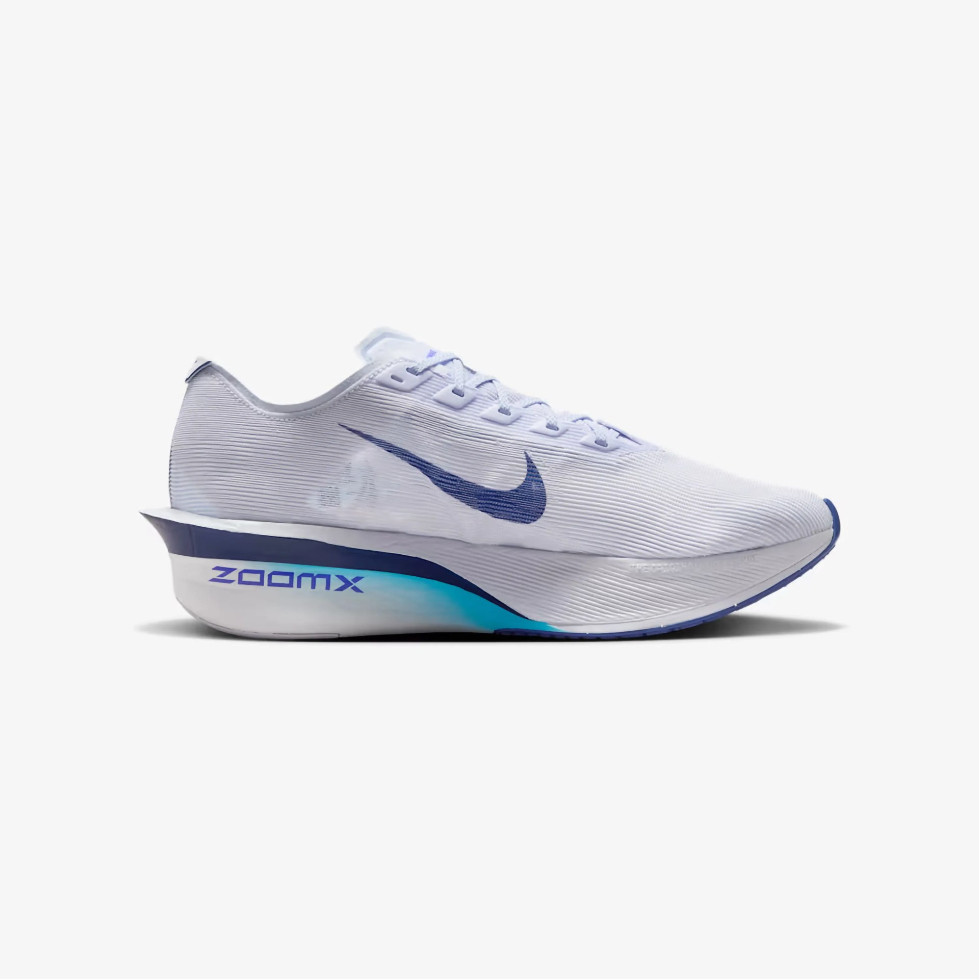 White Nike running shoe with blue swoosh logo and "ZoomX" text on the midsole.
