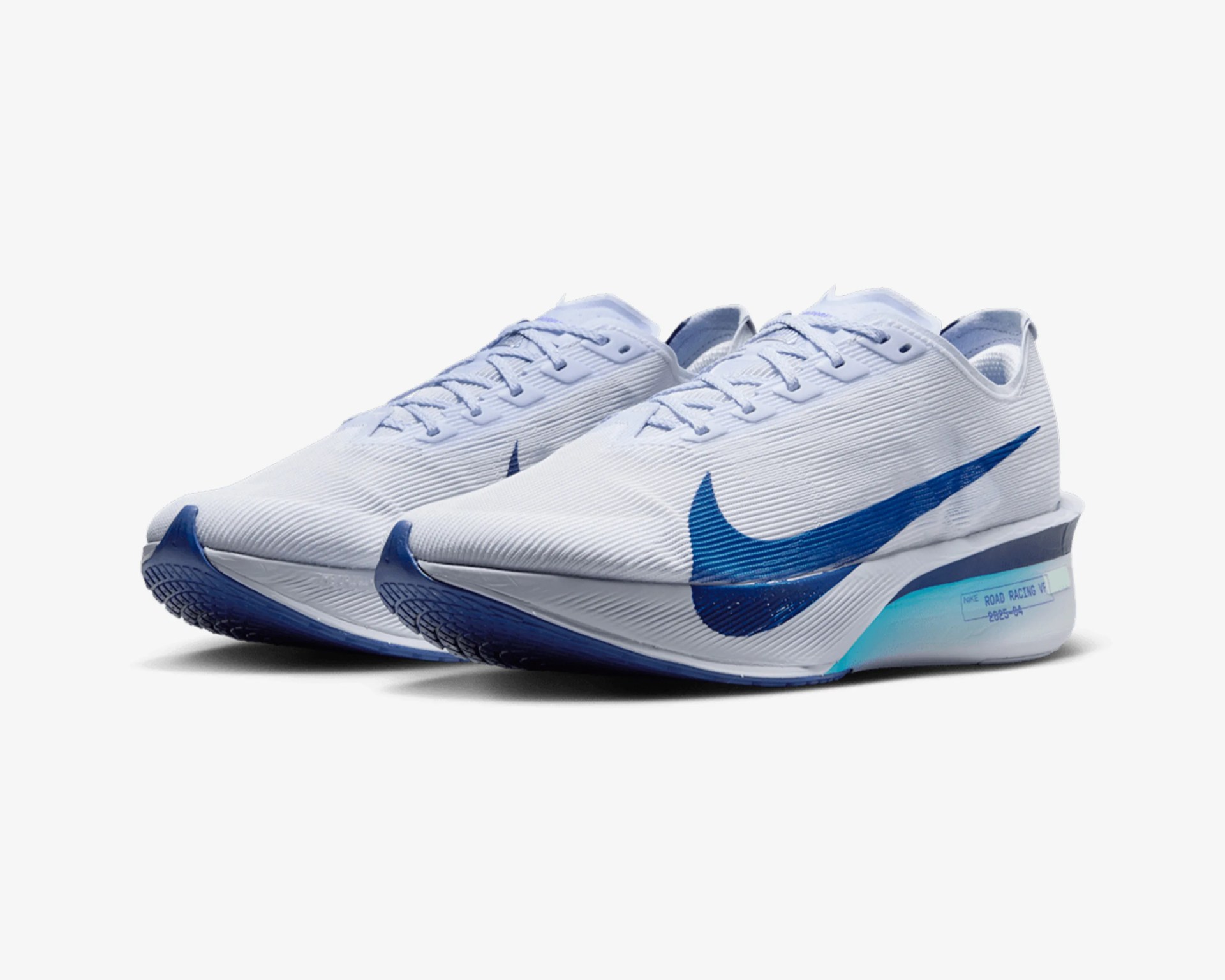 Pair of white Nike running shoes with blue swoosh logos and blue gradient soles.
