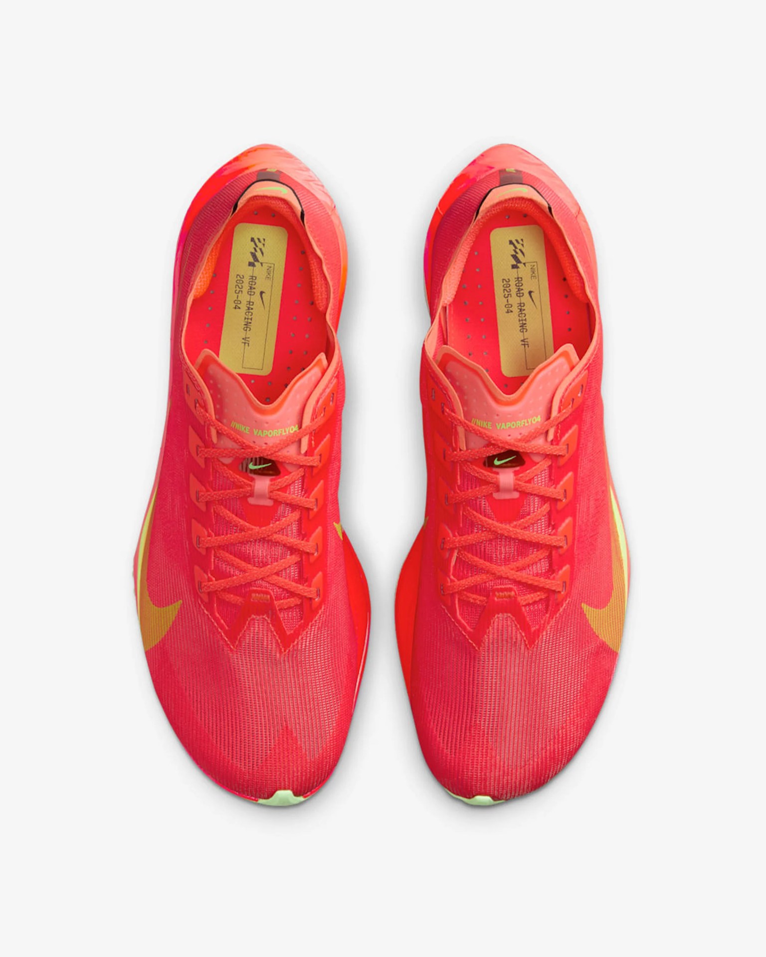 Pair of bright red Nike VaporFly 04 running shoes with yellow swoosh logos, viewed from above.