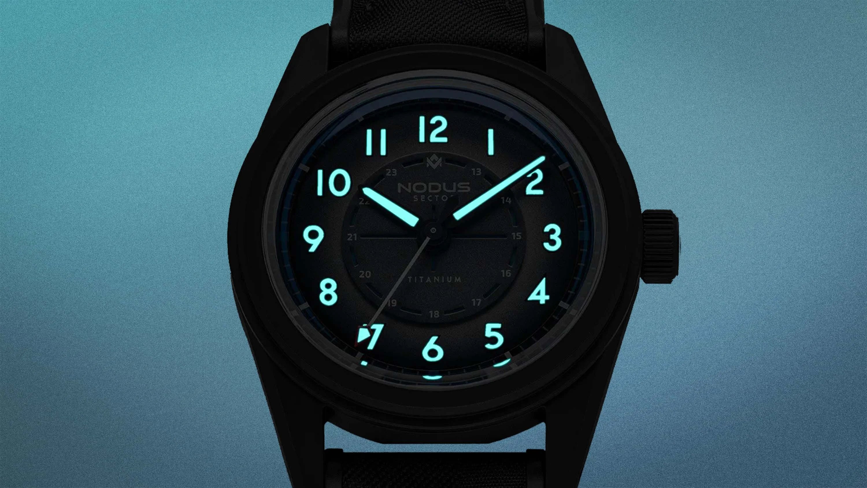 Black wristwatch with glowing blue numerals and hands on a blue gradient background.
