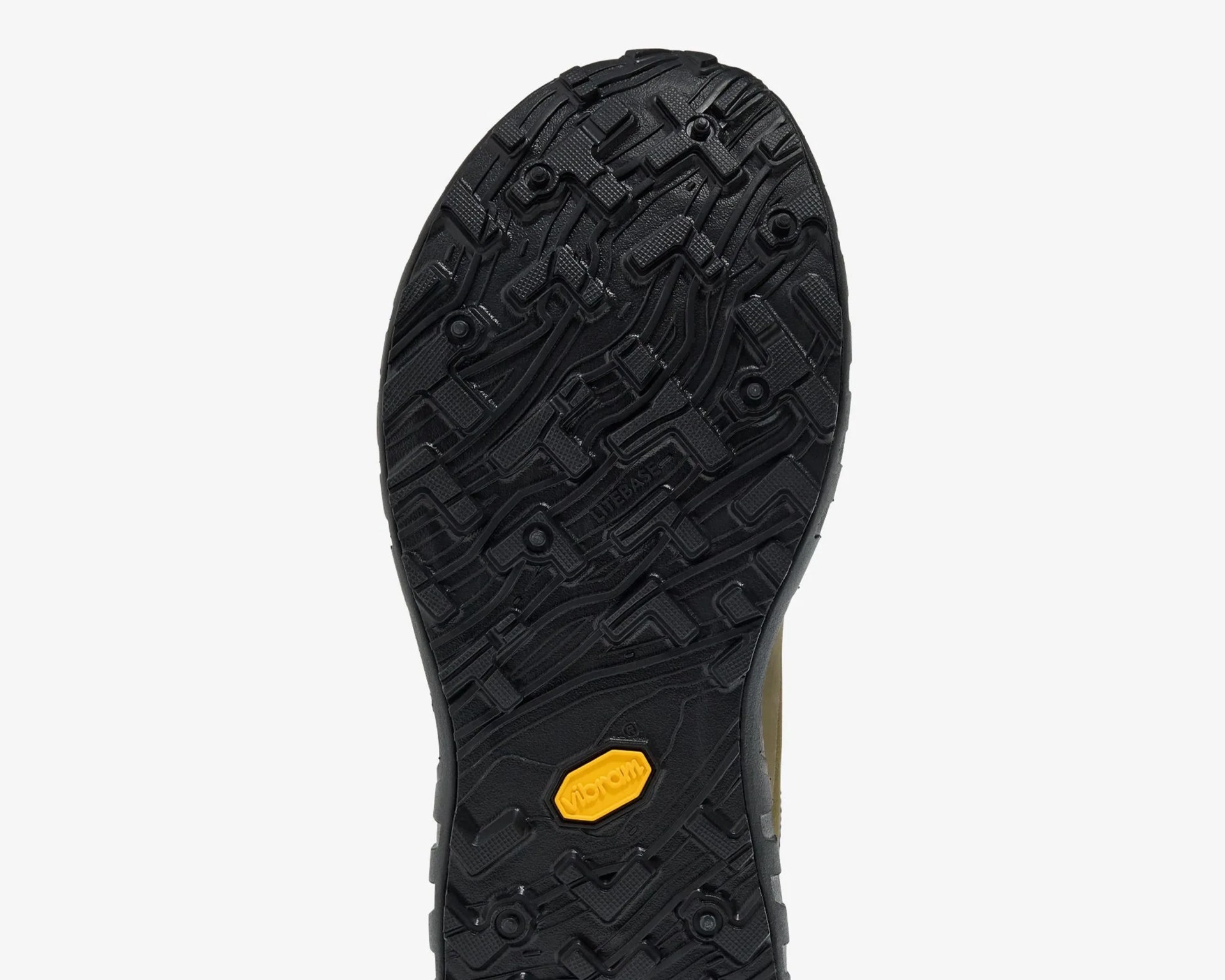Black Vibram rubber shoe sole with textured tread pattern and yellow Vibram logo near the center.