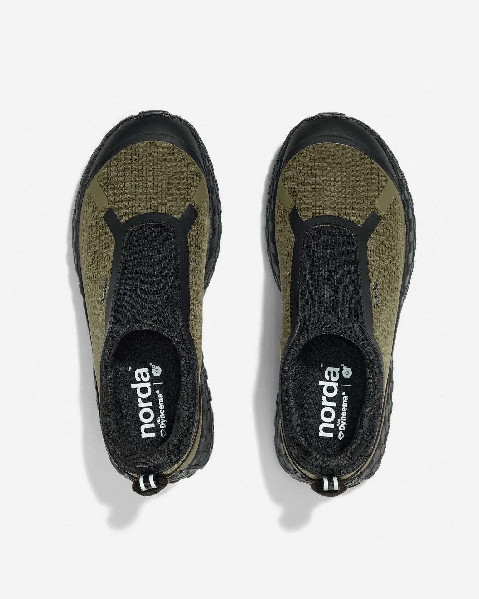 Pair of olive green and black slip-on shoes with black soles and "norda" branding inside.