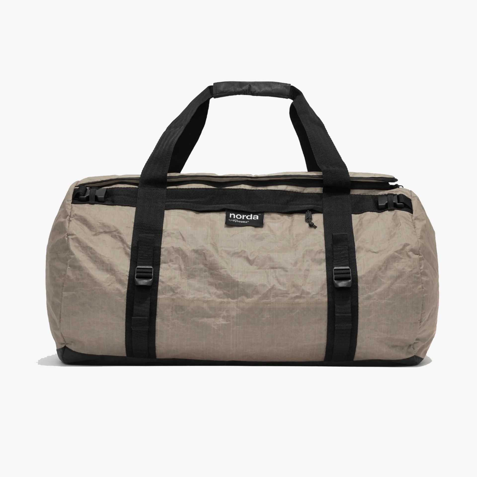 Beige Norda duffel bag with black straps and zipper on a white background.