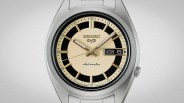 Silver Seiko automatic wristwatch with cream and black dial and day-date display showing Monday the 6th.