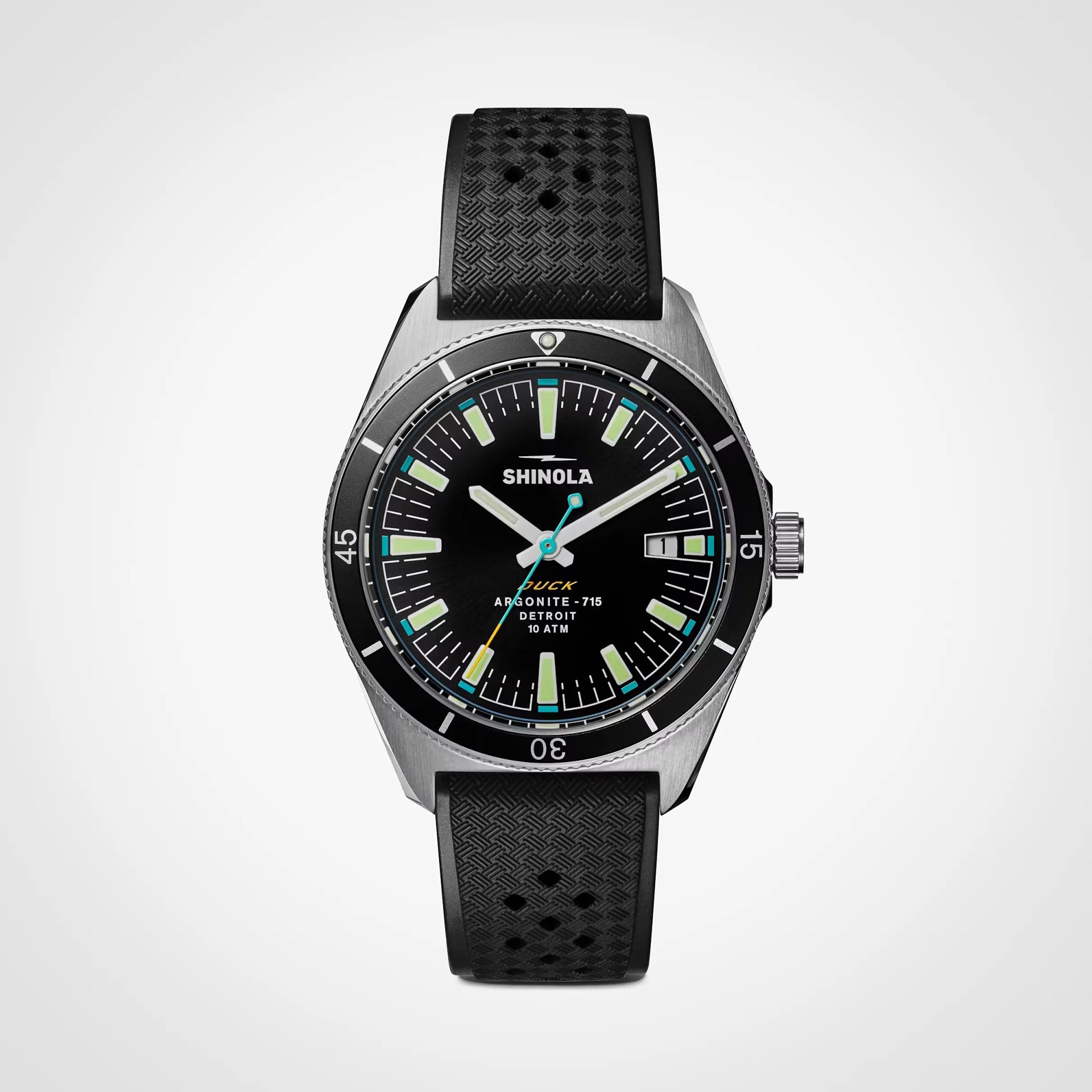 Black dial Shinola wristwatch with luminescent markers, date window, and textured black rubber strap.