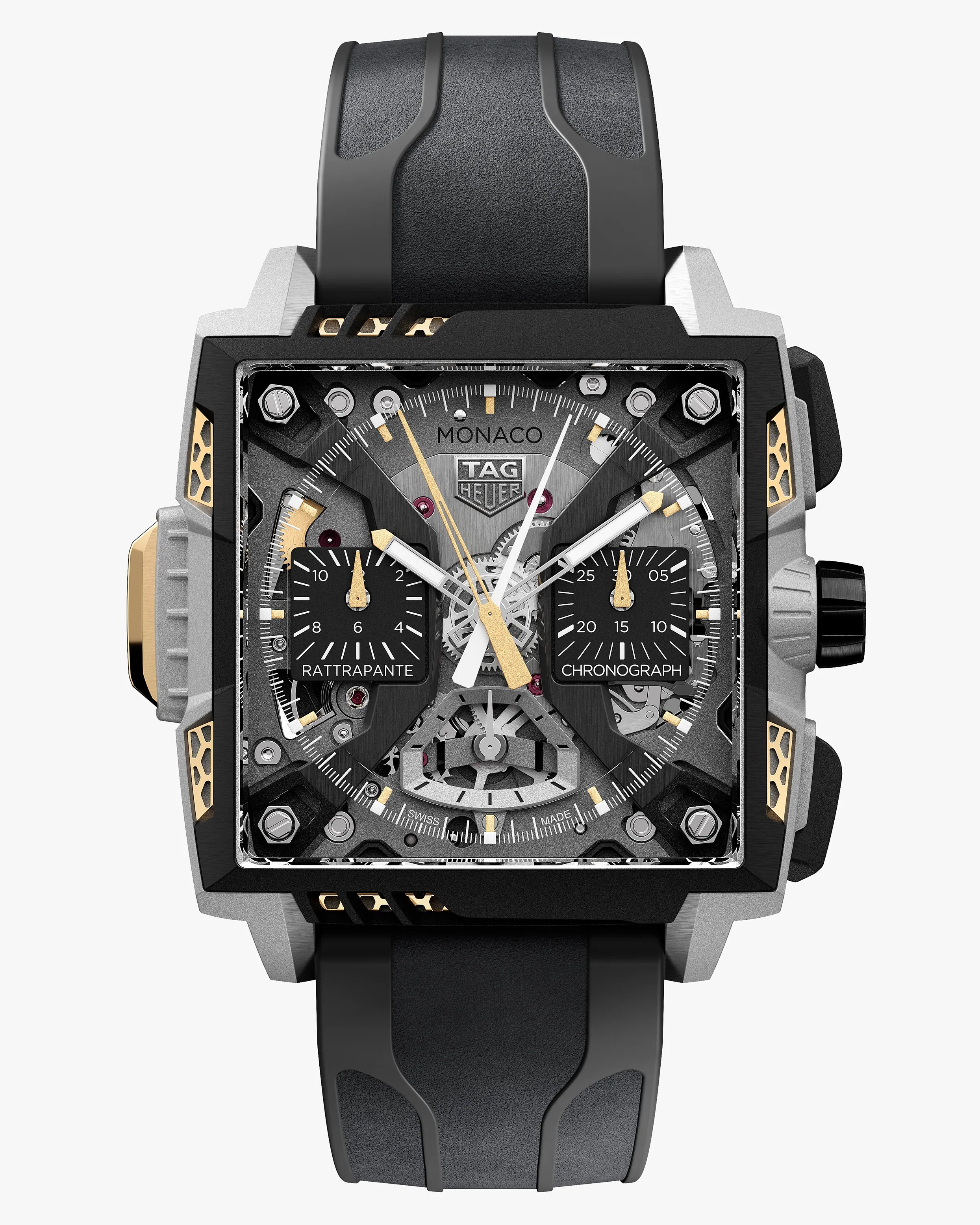 Square TAG Heuer Monaco chronograph watch with black and gold accents and black rubber strap.