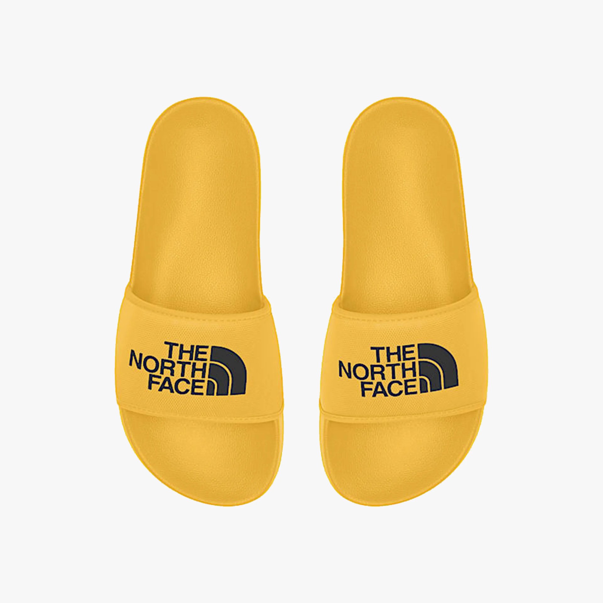 Yellow slide sandals with black "The North Face" logo on the straps.