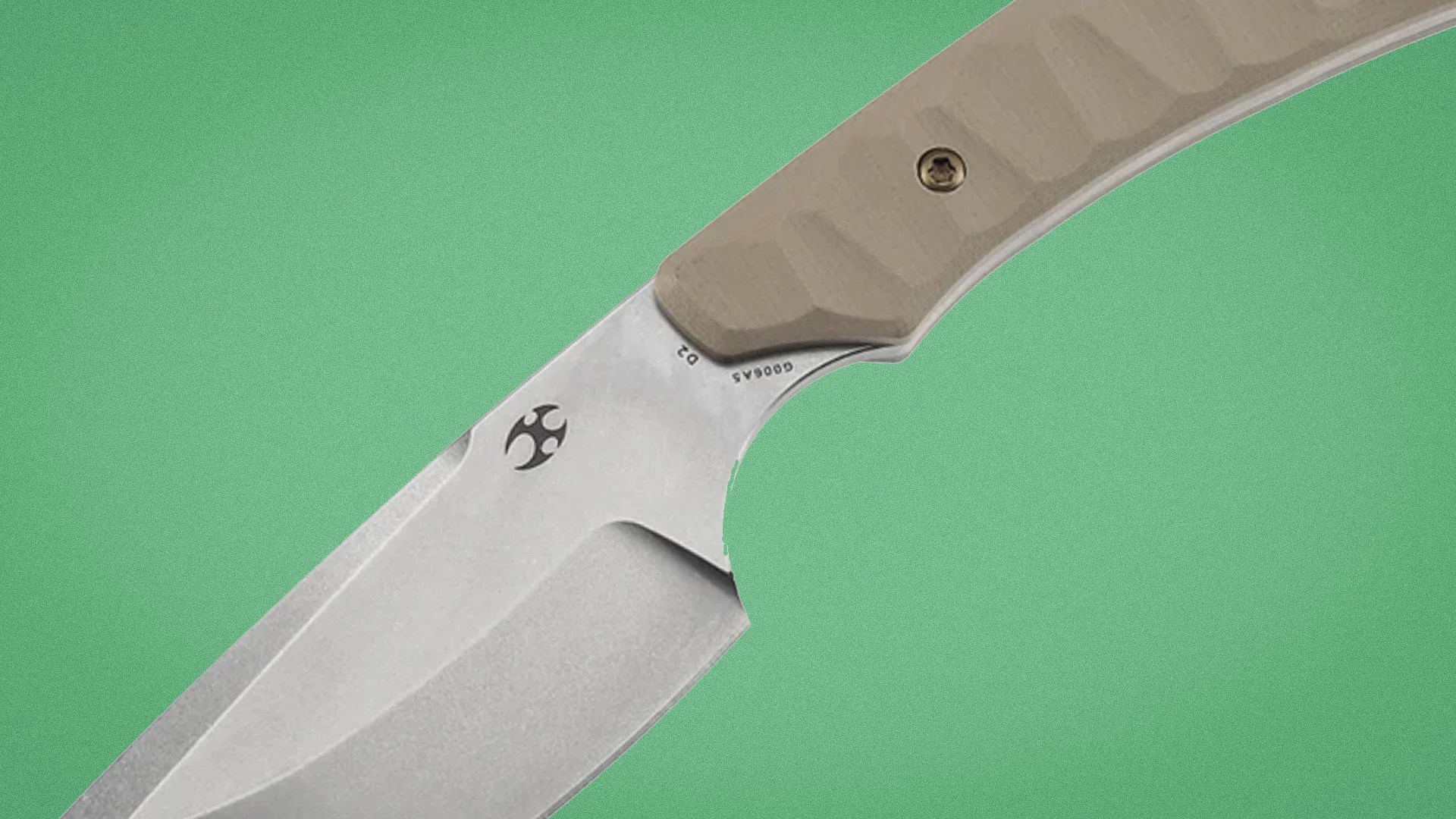 Knife blade with a stonewashed finish and tan textured handle on a green background.