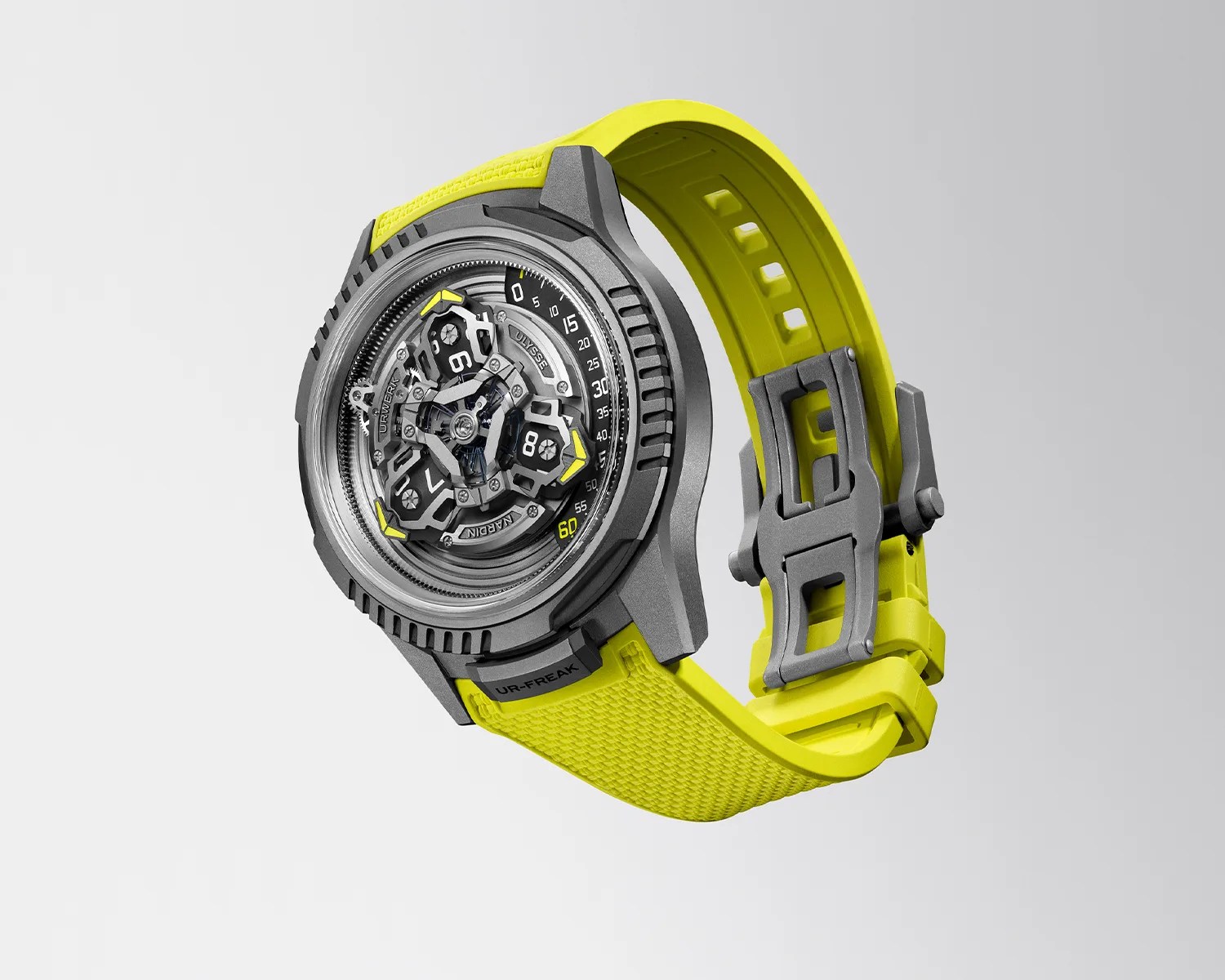 Gray metal watch with a complex mechanical dial and bright yellow textured rubber strap.