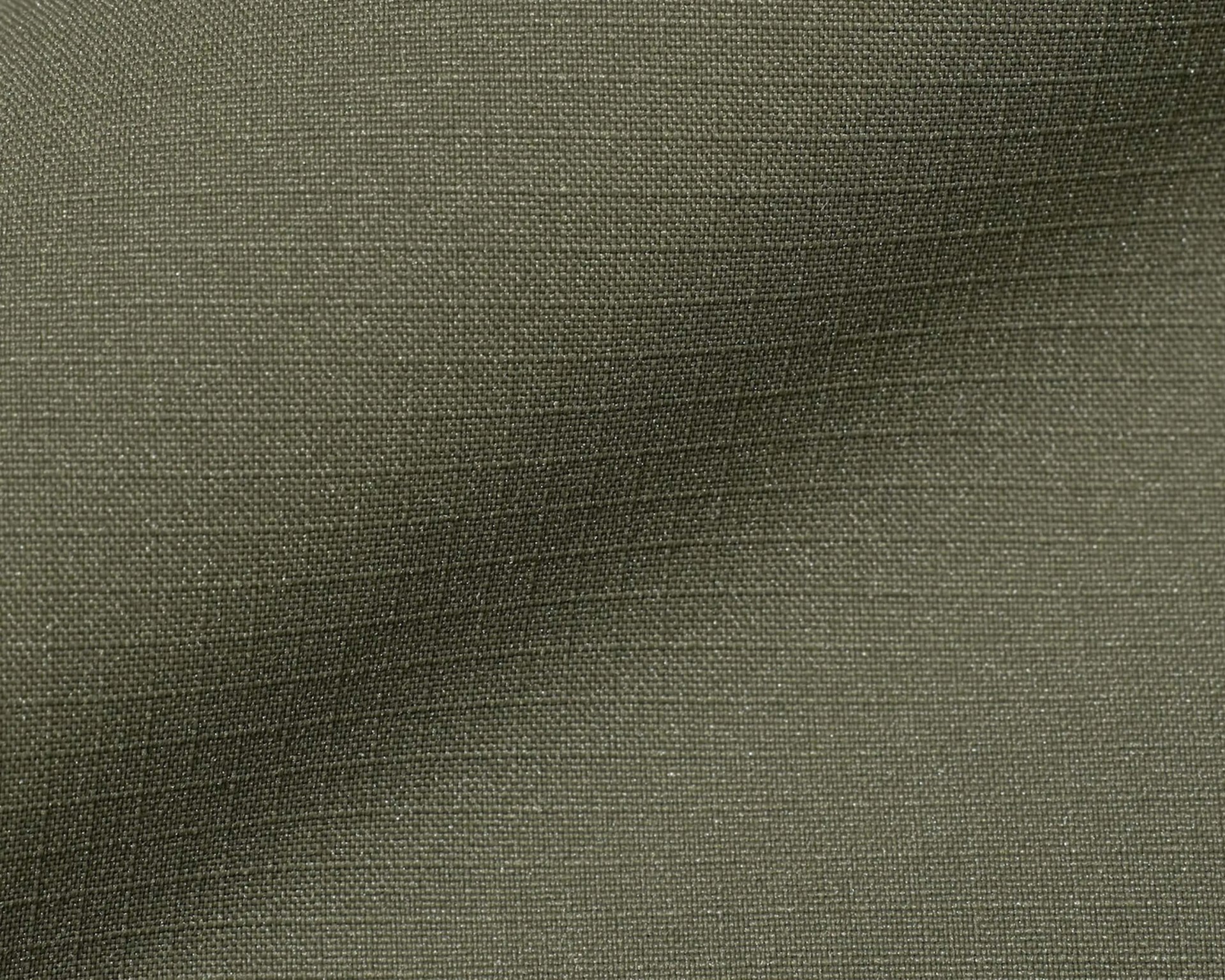 Close-up of olive green woven fabric with a slightly textured surface.