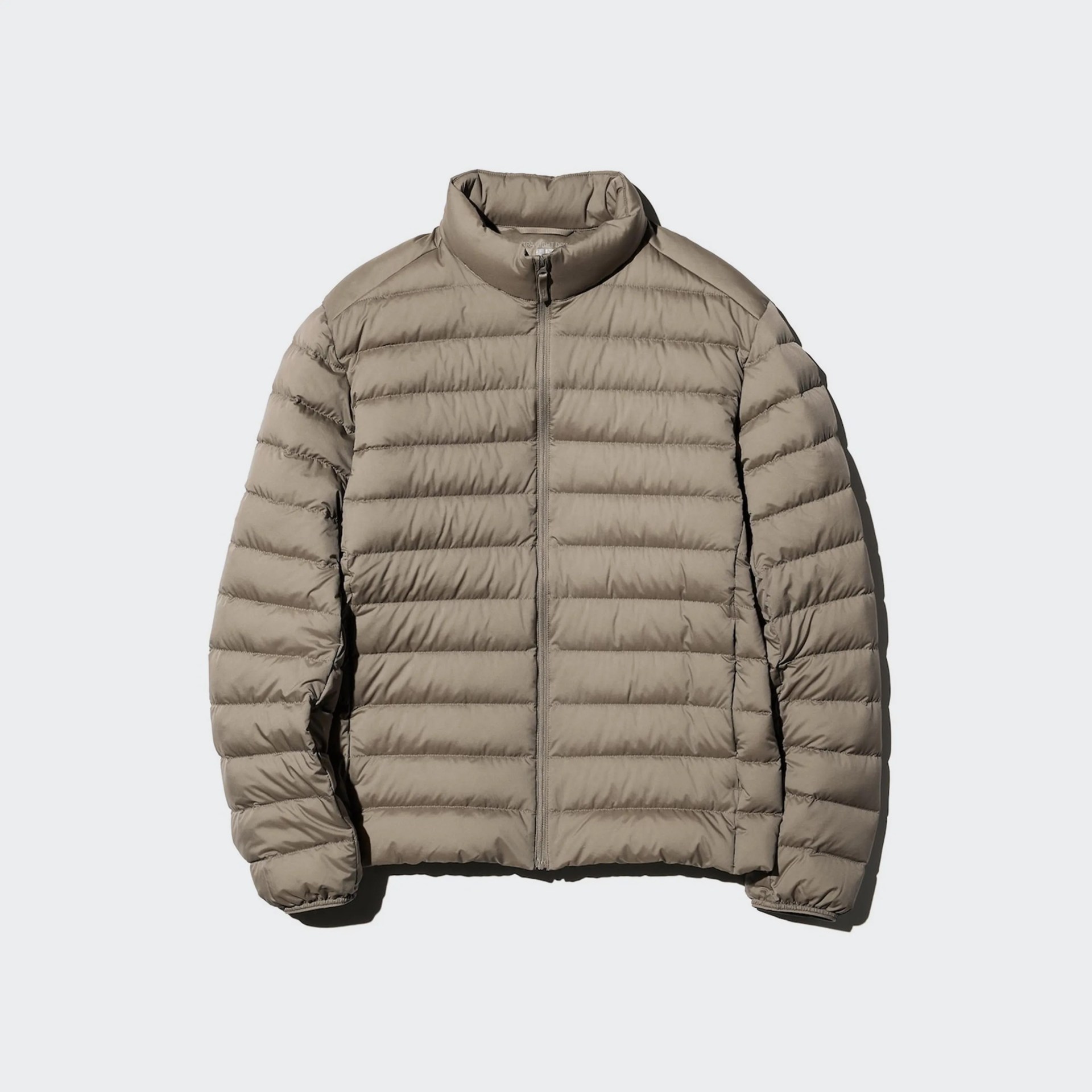 Light brown quilted puffer jacket with a stand collar and front zipper on a white background.