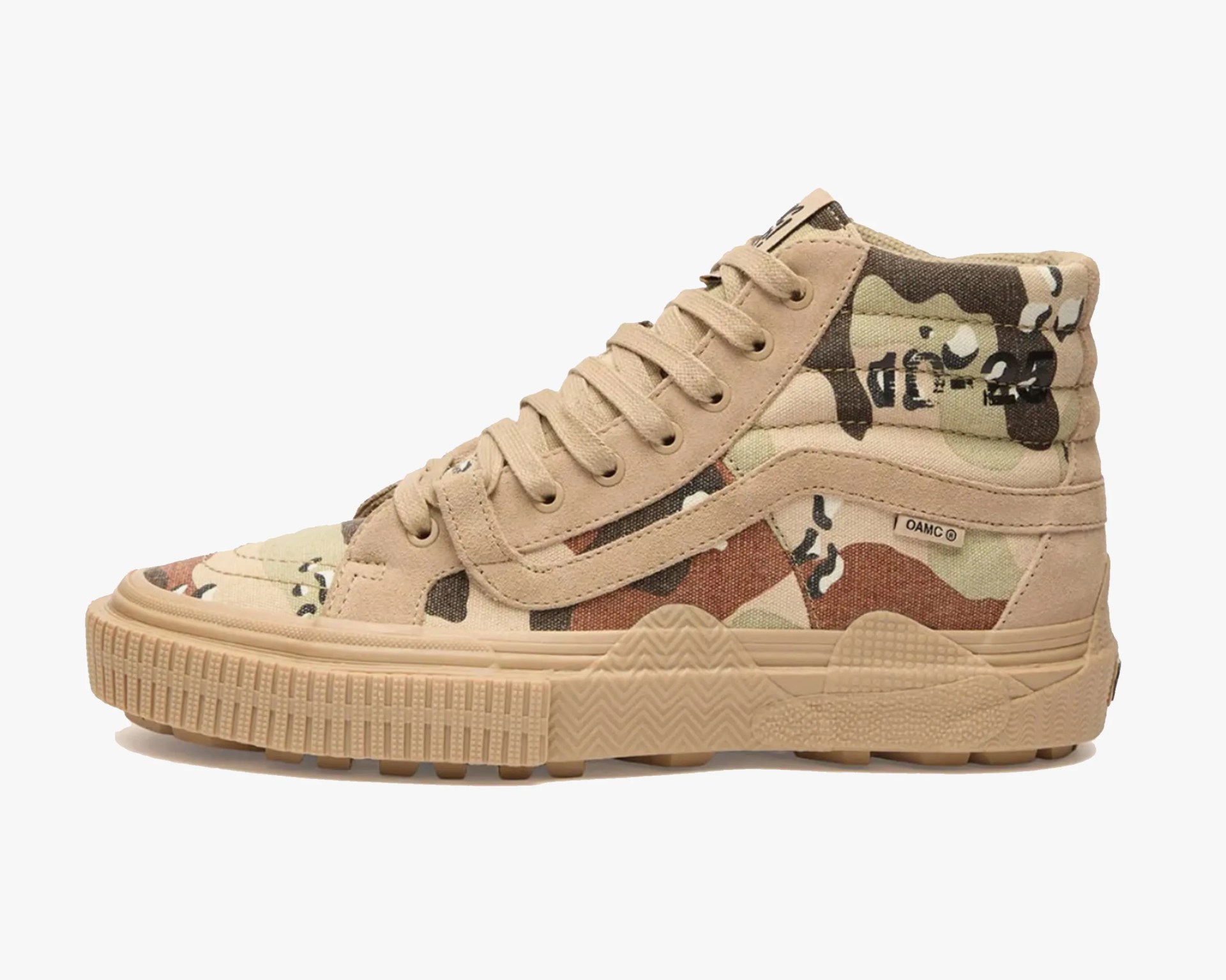 High-top sneaker with beige suede and camouflage canvas upper and thick beige rubber sole.