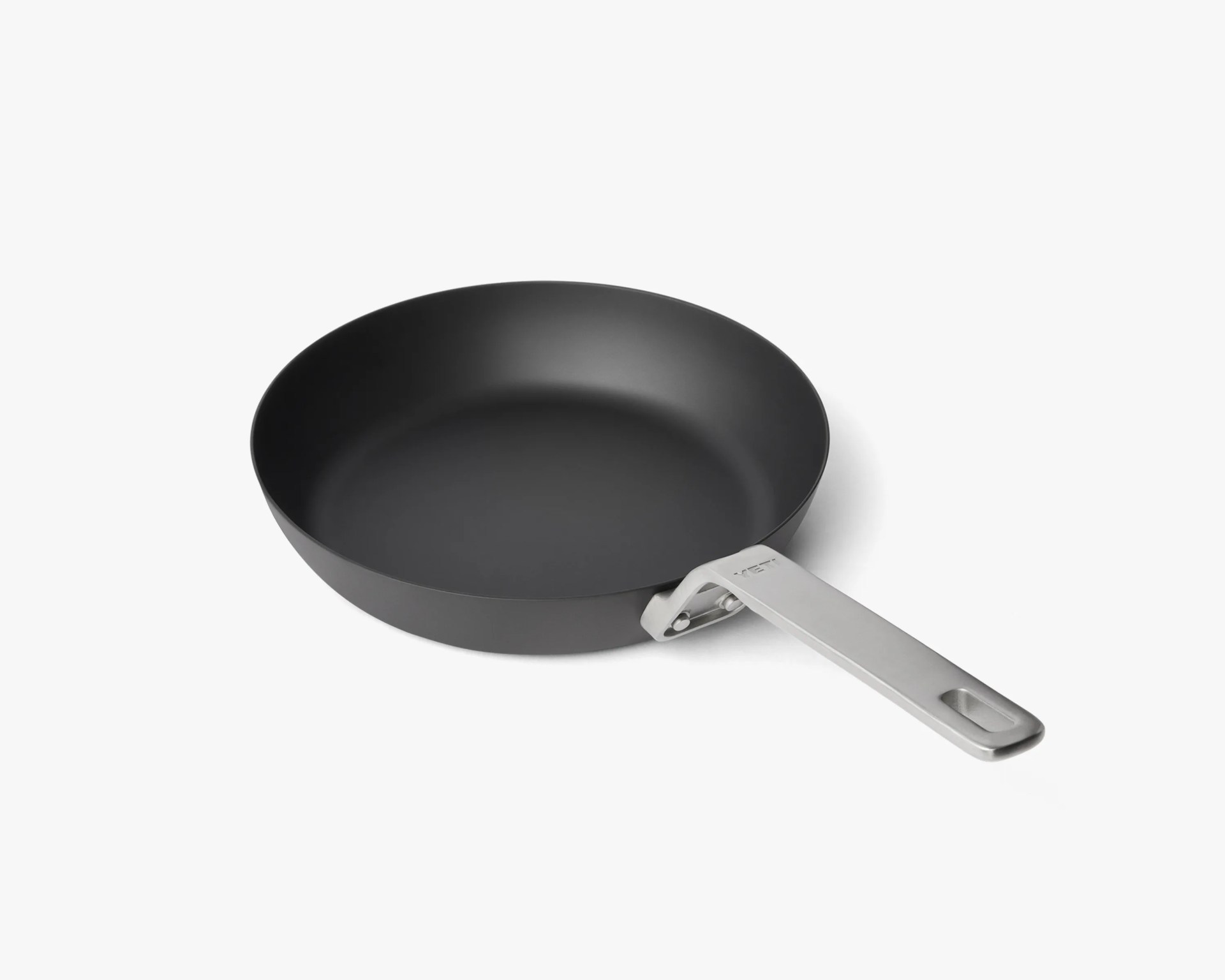 Black nonstick frying pan with a silver metal handle on a white background.