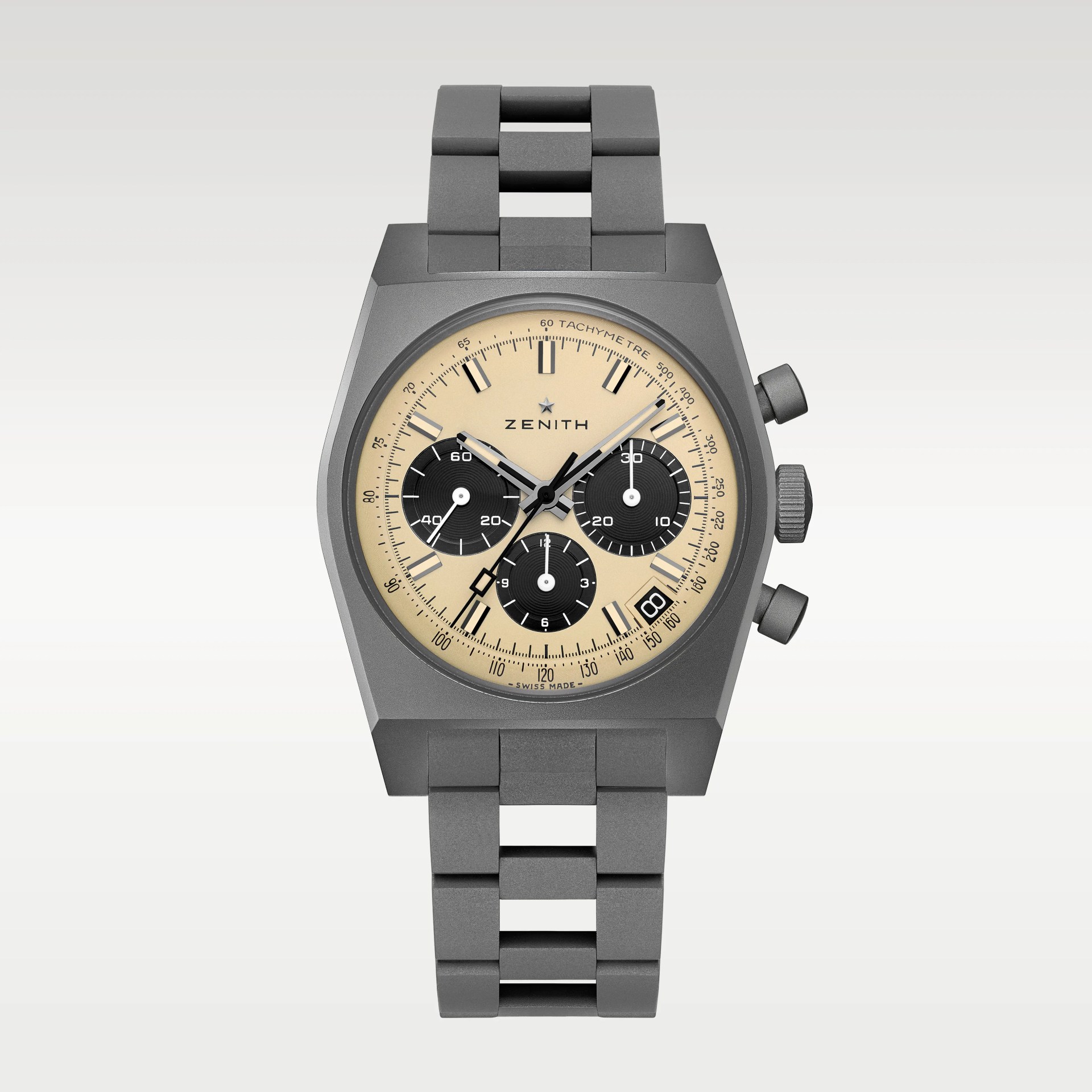 Matte gray metal Zenith chronograph watch with beige dial and three black subdials on a matching metal bracelet.