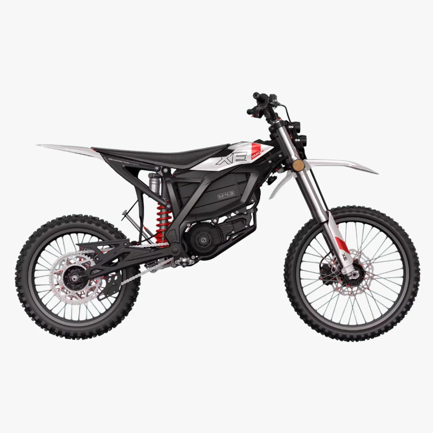 Black and white electric dirt bike with knobby tires and red suspension spring.