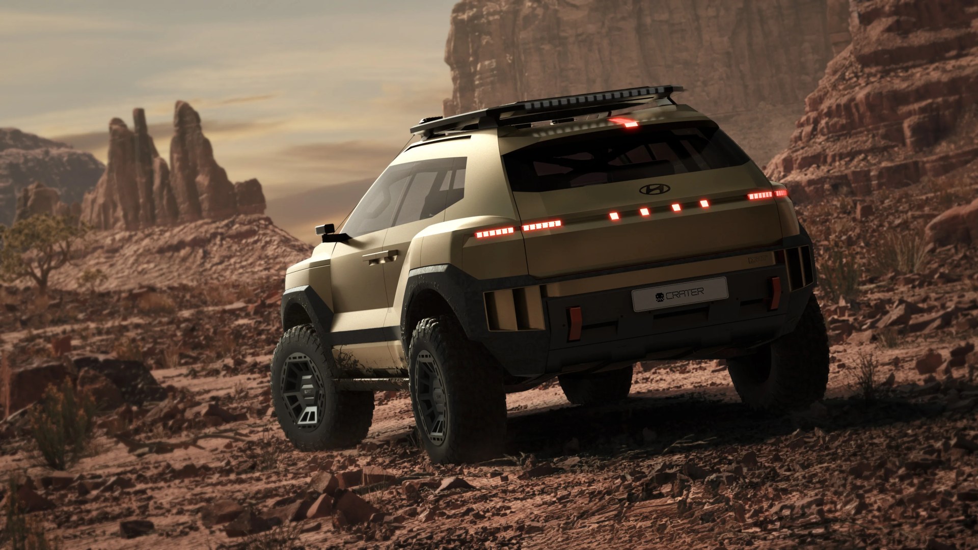 Beige Hyundai SUV with off-road tires and roof rack on rocky desert terrain near red rock formations.