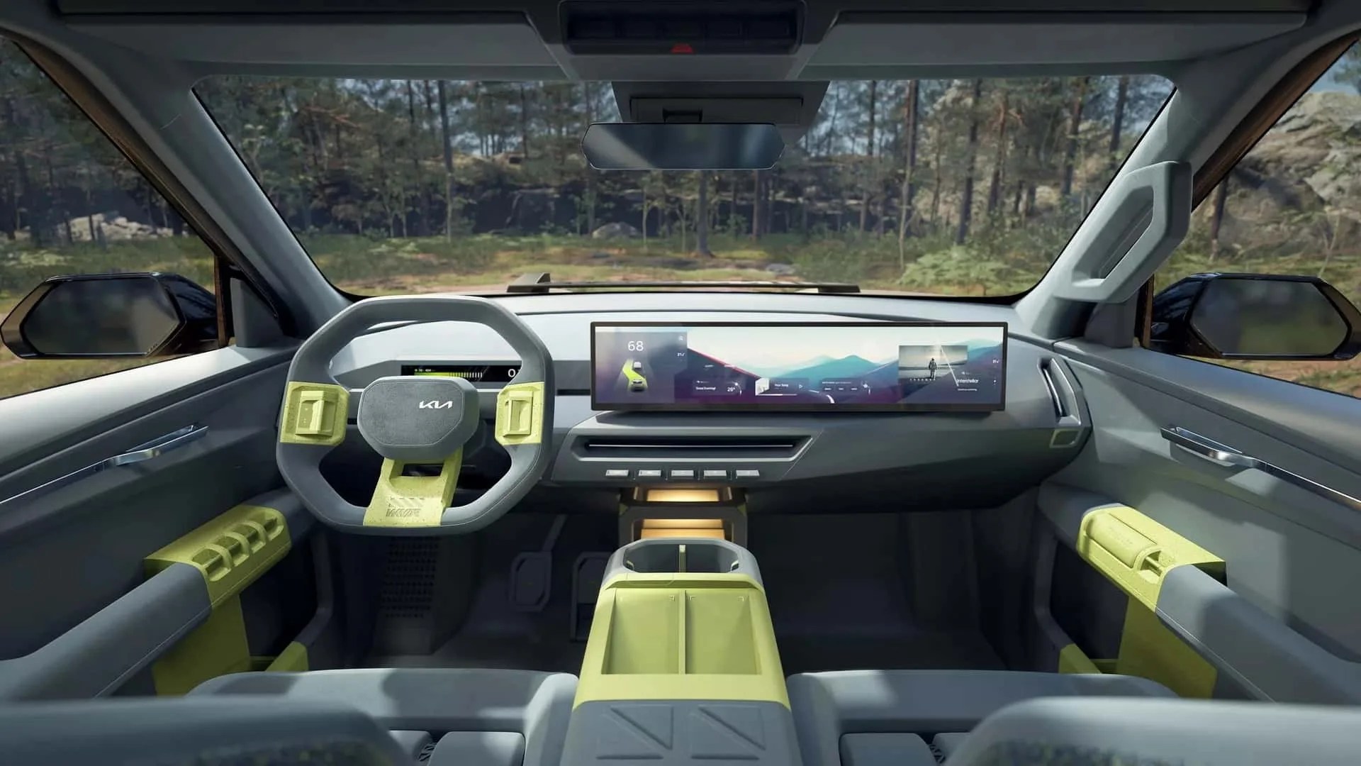 Futuristic car interior with gray and lime green accents, hexagonal steering wheel, and wide digital dashboard display.