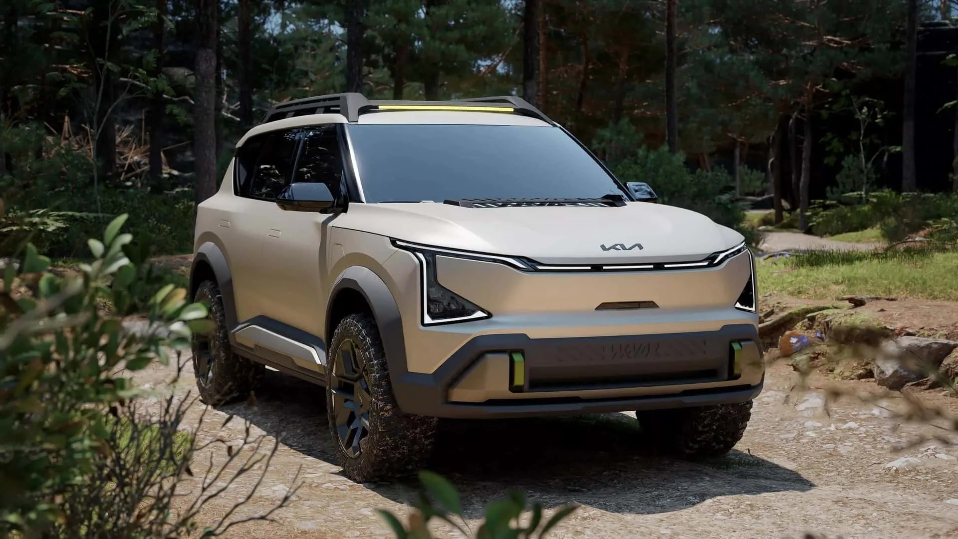 Beige Kia SUV with black trim and roof rails parked on a dirt path in a forest.