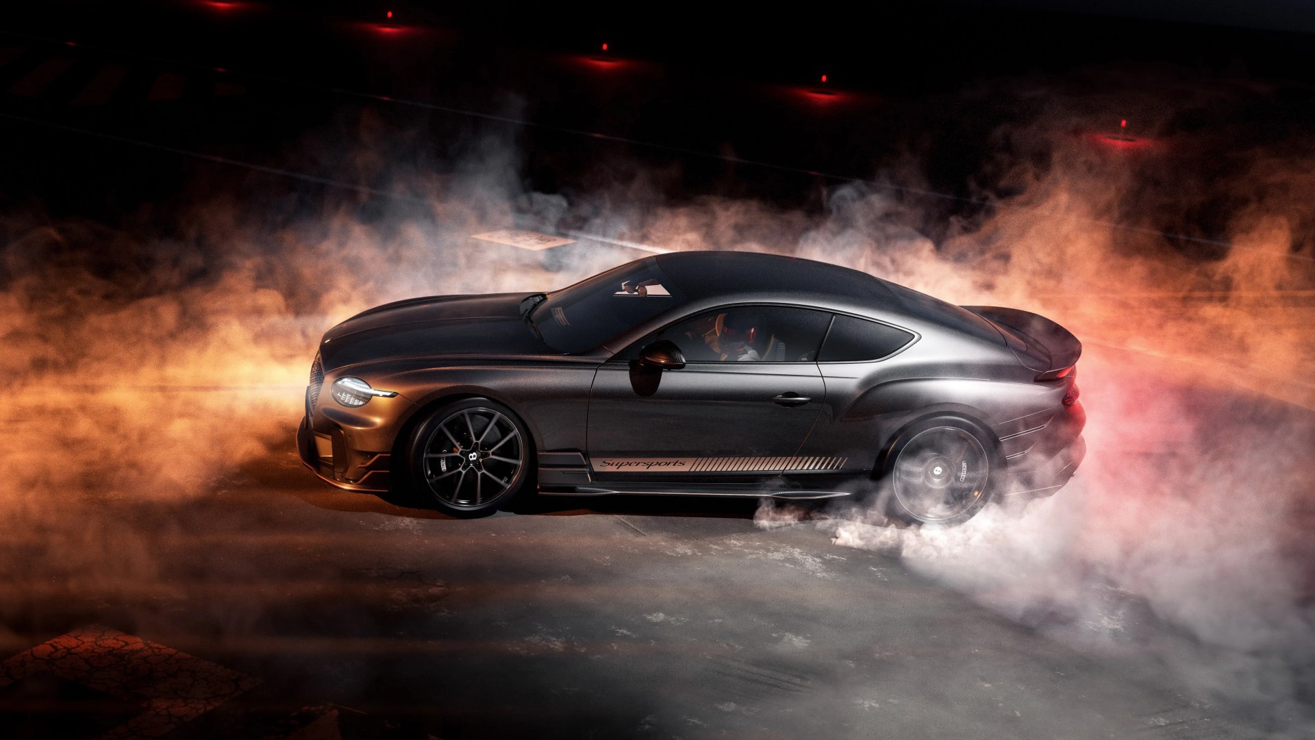 Matte black Bentley Continental GT Supersports performing a burnout with smoke around the rear tires.