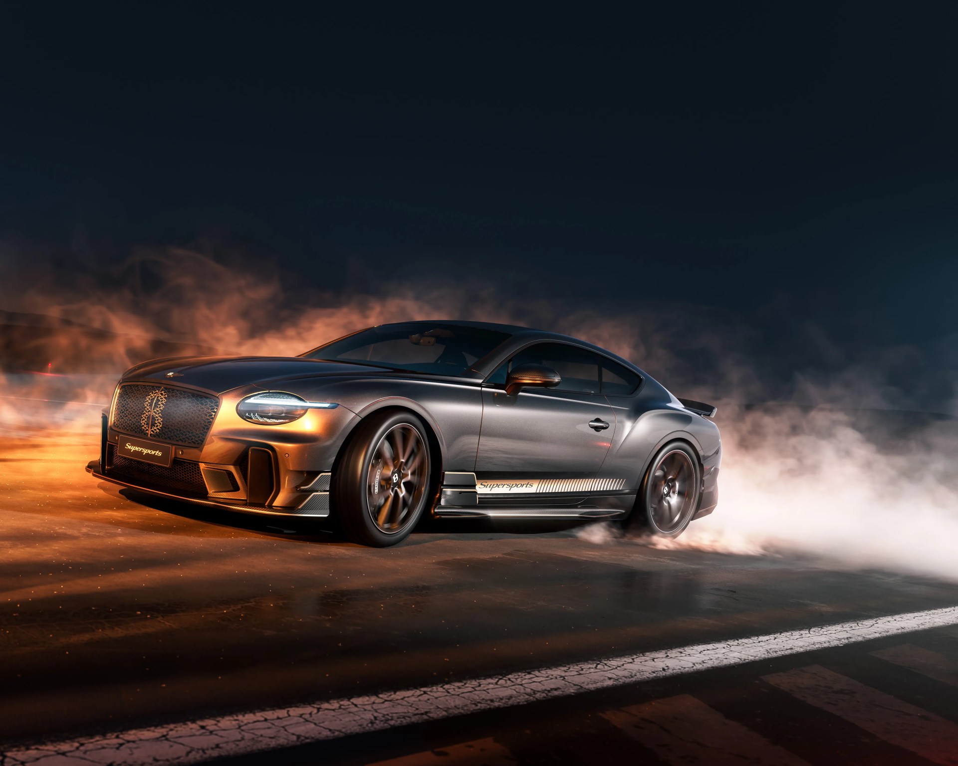 Gray Bentley Supersports coupe drifting on a smoky asphalt road at night.