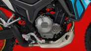 Close-up of a motorcycle engine with a silver protective skid plate and black and blue body panels against a red background.