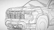 Line drawing of the front and side of a pickup truck with a detailed grille and headlight design.
