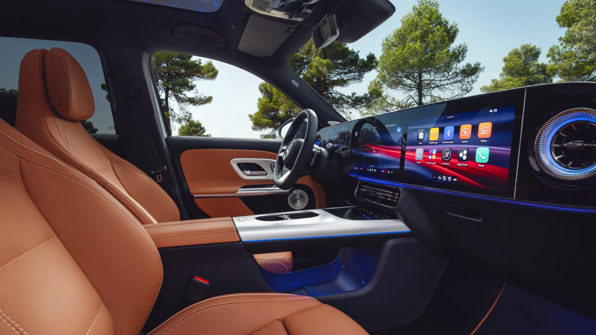 Car interior with tan leather seats, digital dashboard with touchscreen displays, and ambient blue lighting.