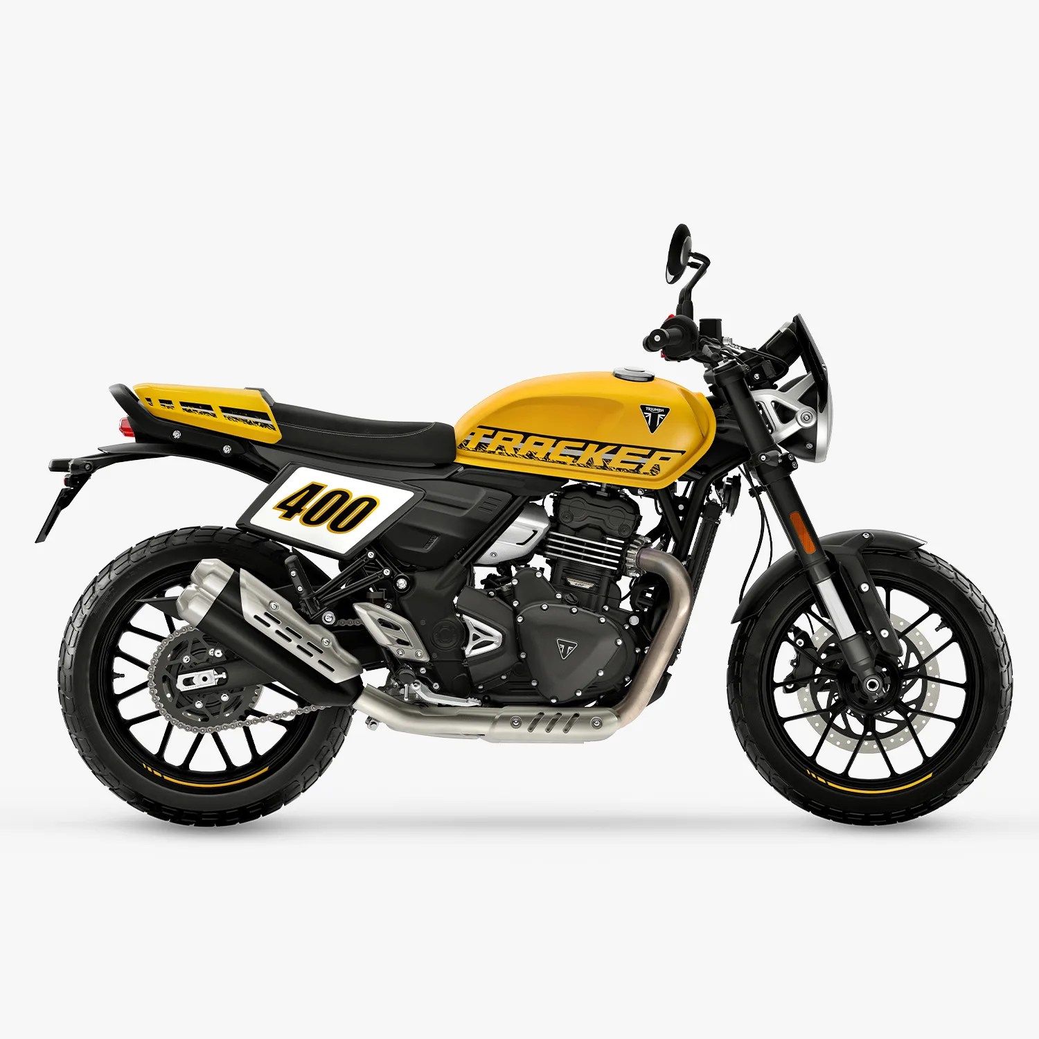 Yellow and black Triumph Tracker 400 motorcycle with black seat and silver exhaust on white background.