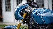 Blue BMW motorcycle fuel tank and front fairing with gold front suspension forks.