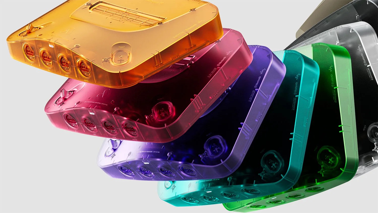 Stack of translucent retro gaming consoles in orange, red, purple, blue, green, and clear colors.