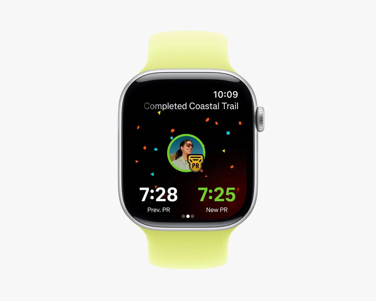 Smartwatch with silver case and yellow-green silicone band displaying a completed Coastal Trail run with previous and new personal record times.