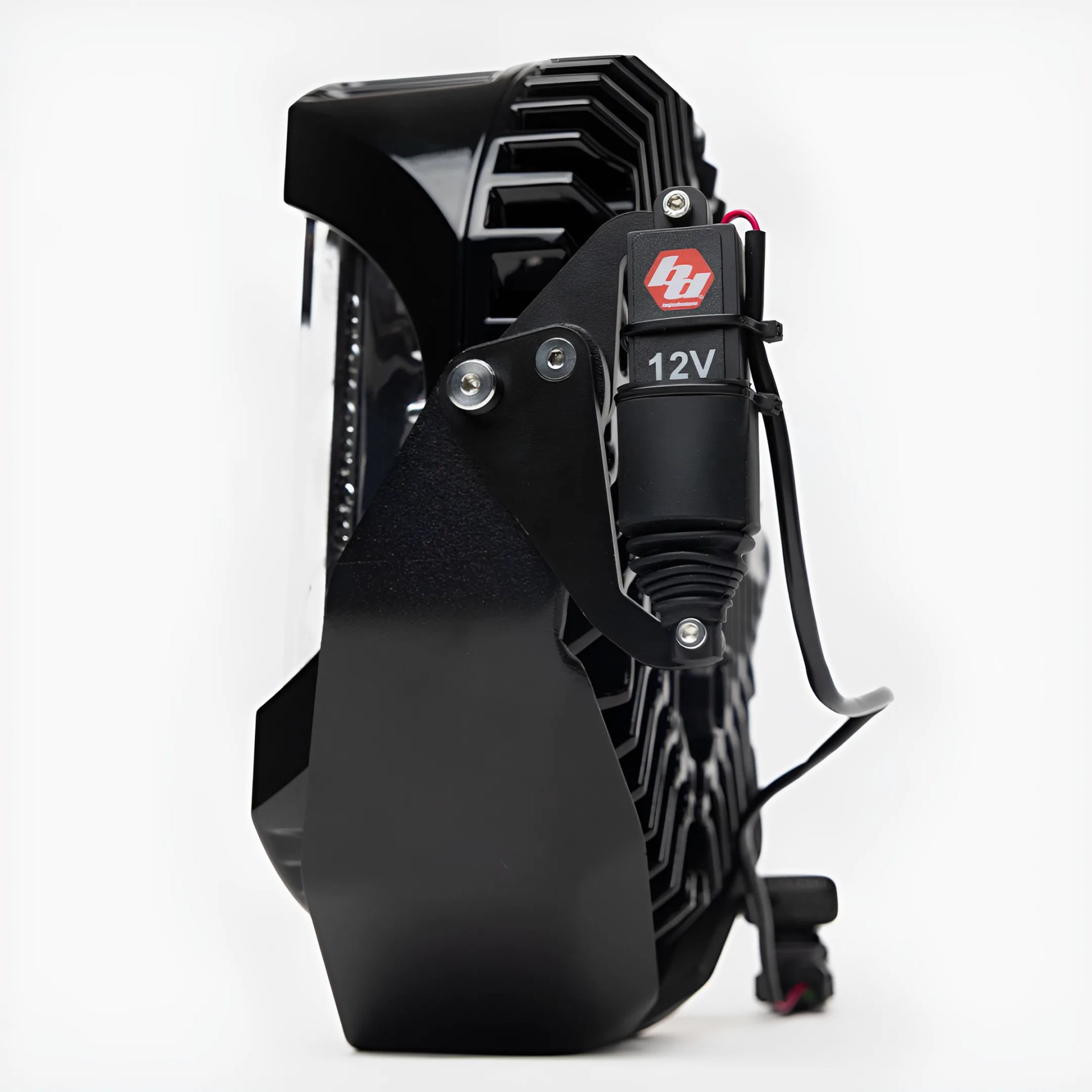 Black 12V LED light bar with cooling fins and mounting bracket against a white background.