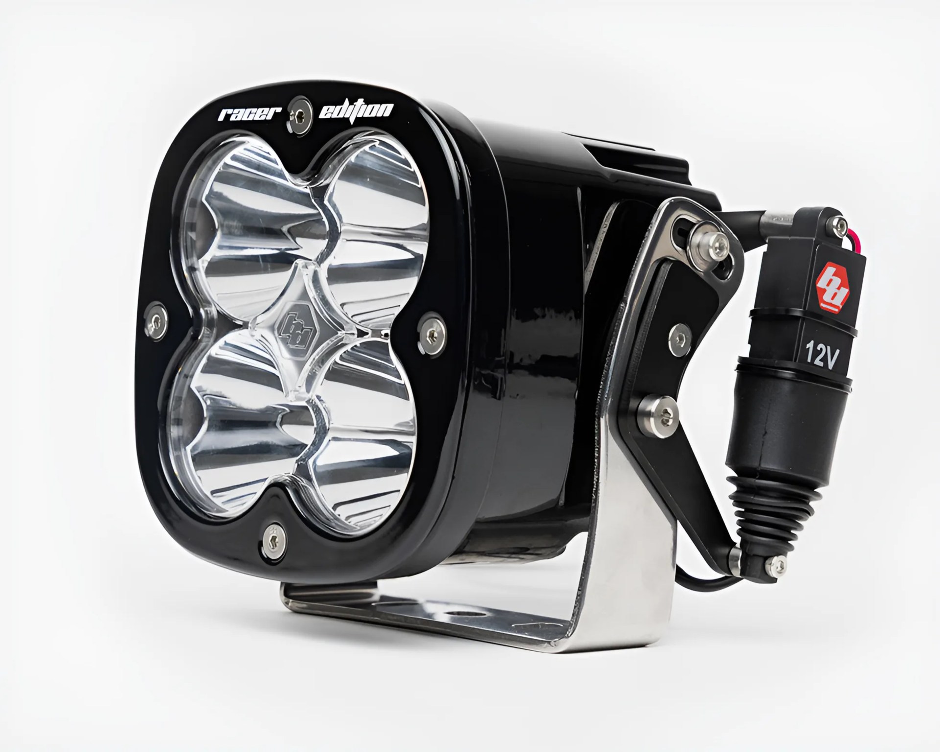 Black rectangular LED off-road light with four reflectors and a metal mounting bracket.