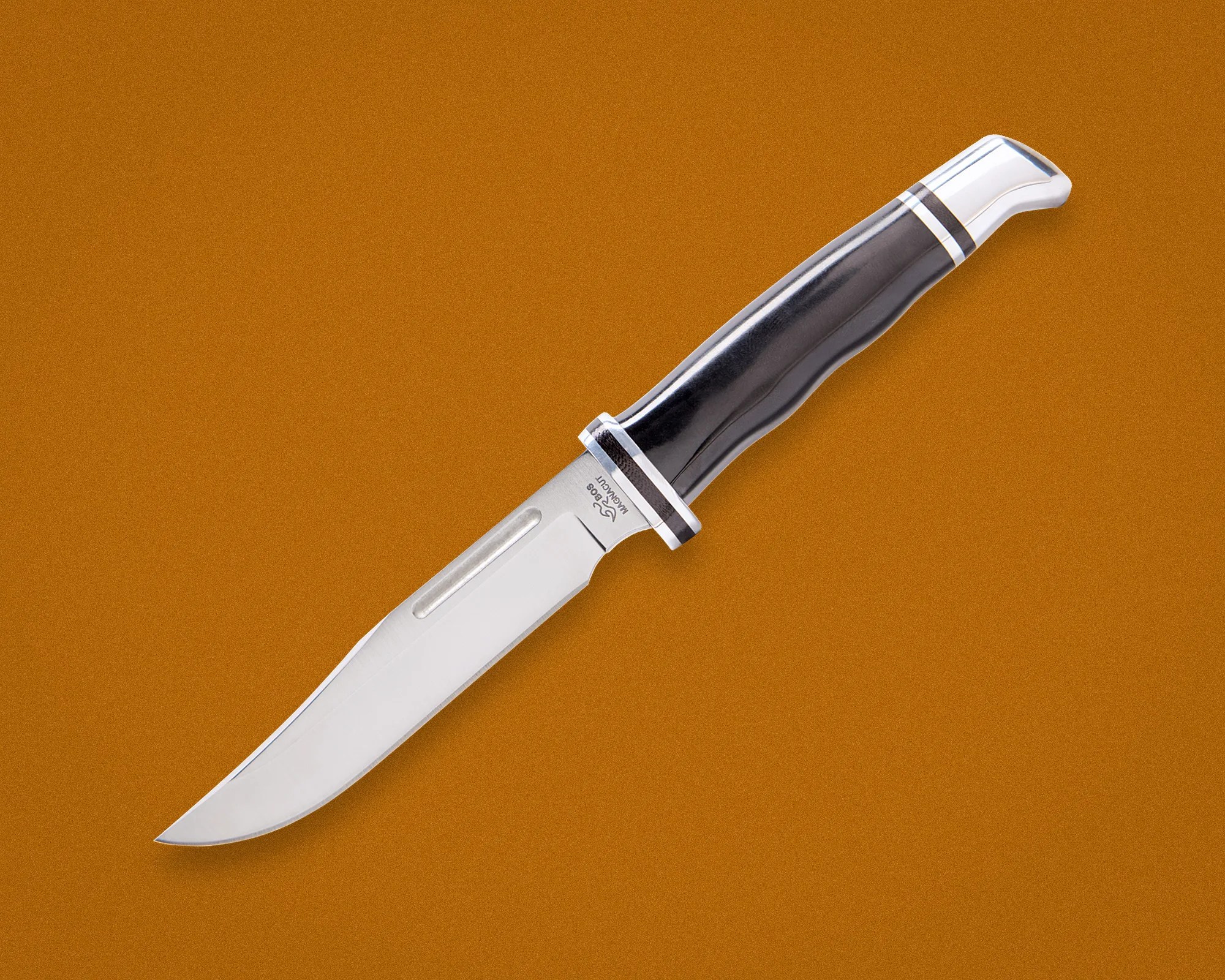 Fixed-blade hunting knife with a polished steel blade and black ergonomic handle on a brown background.