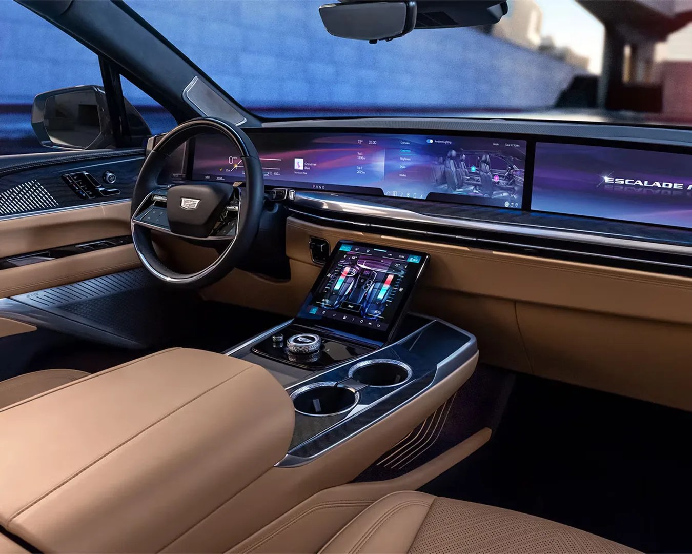 Luxury car interior with tan leather seats, digital dashboard, touchscreen center console, and black steering wheel.