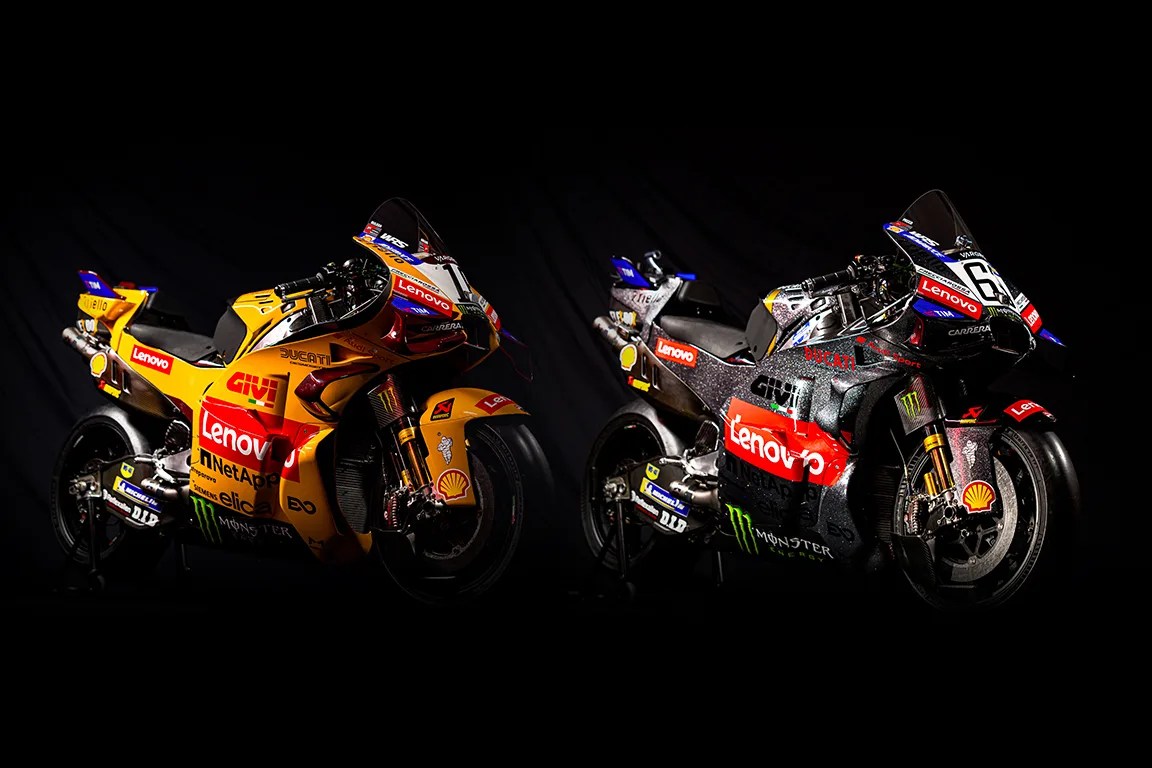 Two Ducati racing motorcycles with Lenovo and Shell logos, one in yellow and the other in black, against a black background.