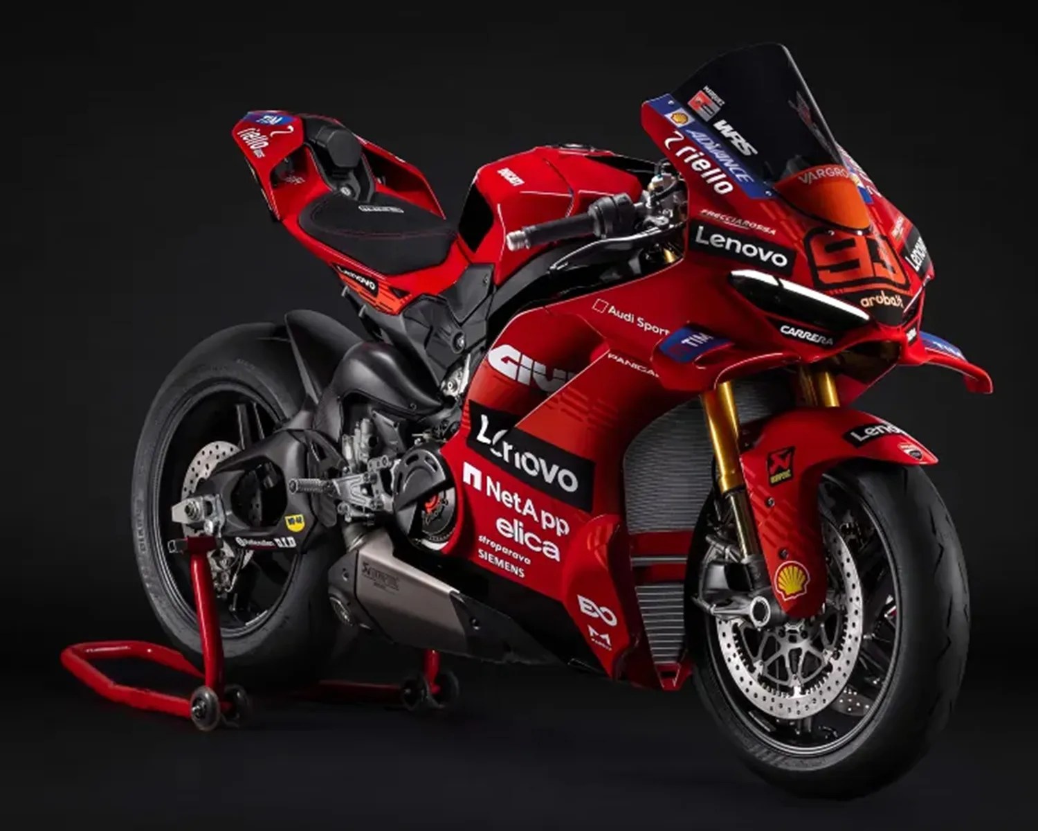 Red Ducati racing motorcycle with Lenovo and Shell logos on a black background.