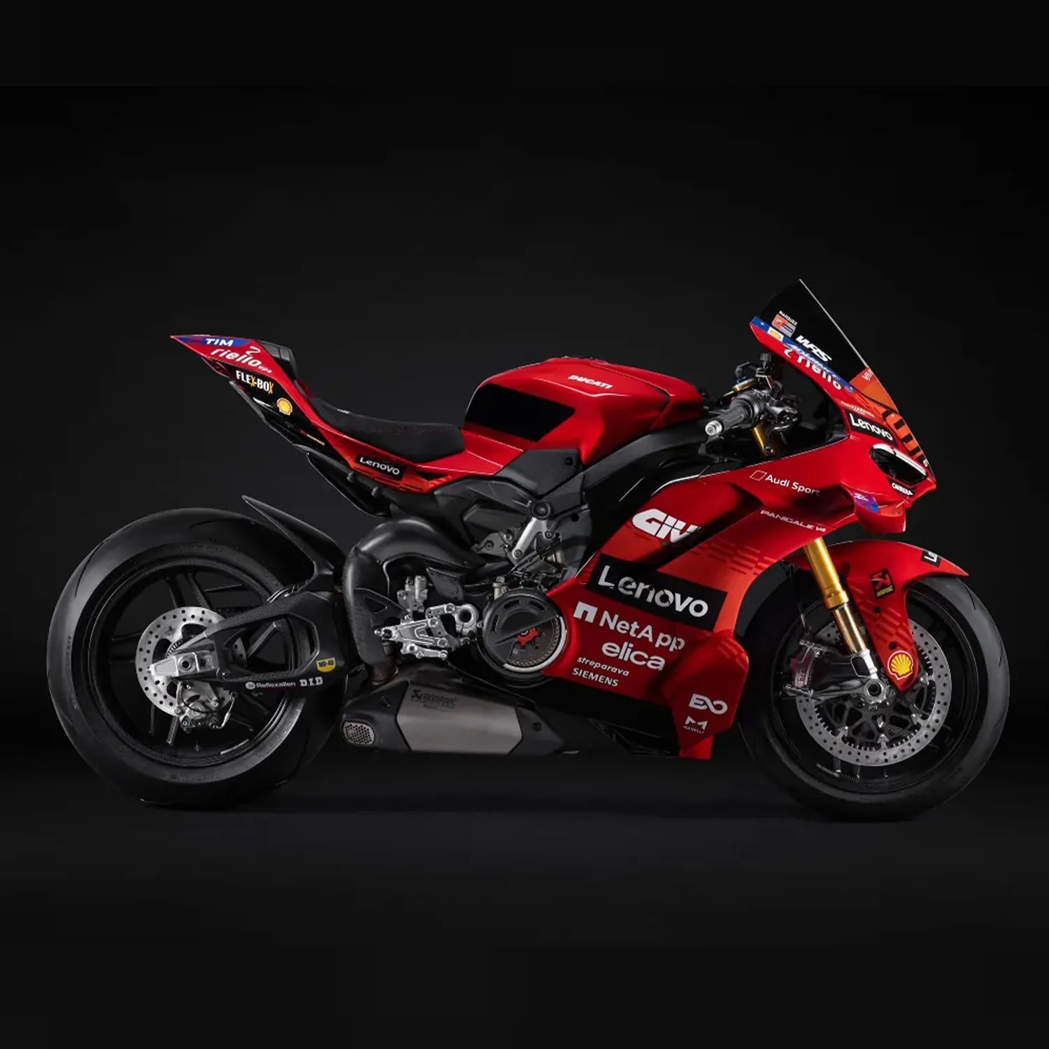 Red Ducati racing motorcycle with Lenovo and other sponsor logos on a black background.