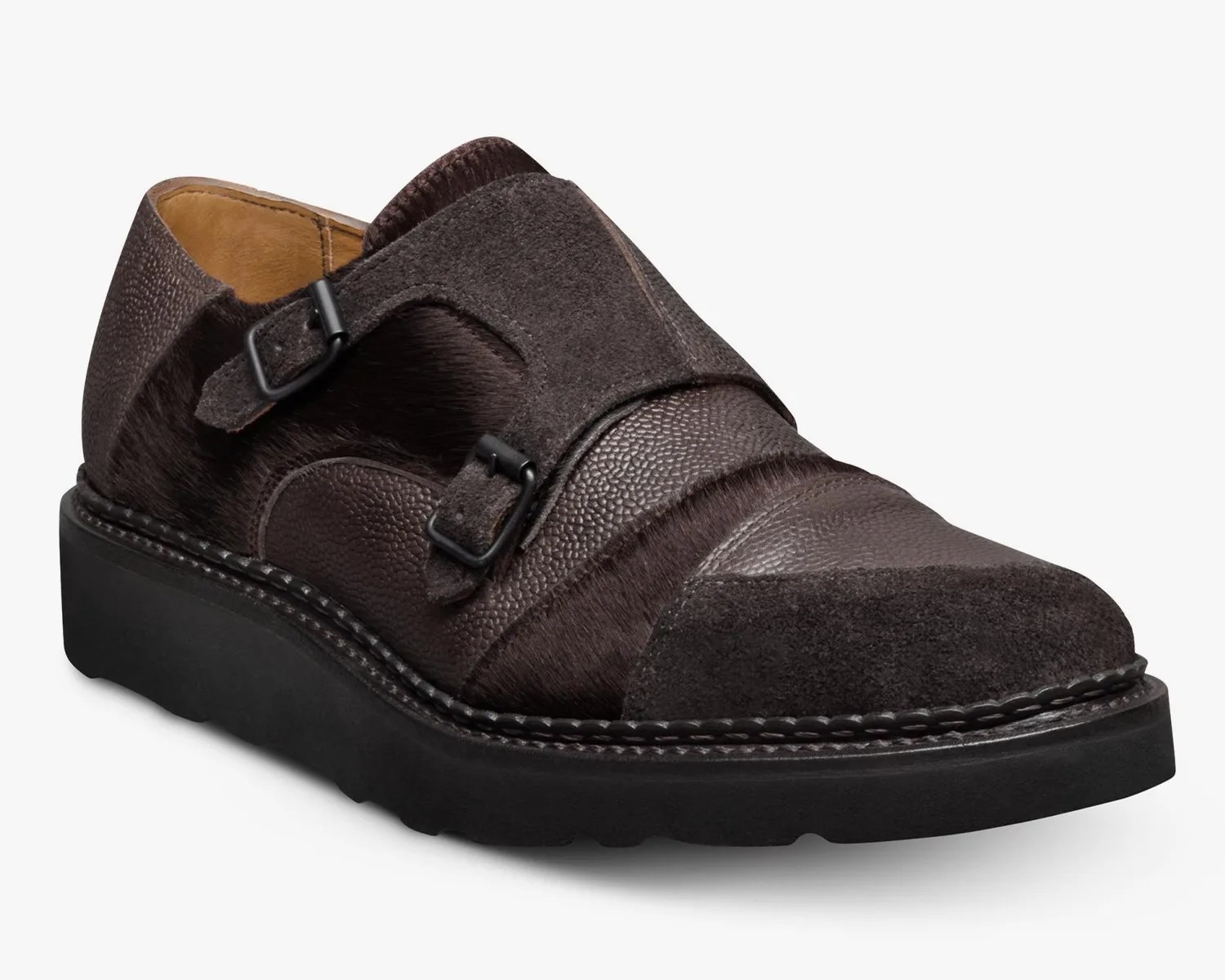 Dark brown leather and suede double monk strap shoe with black rubber sole.