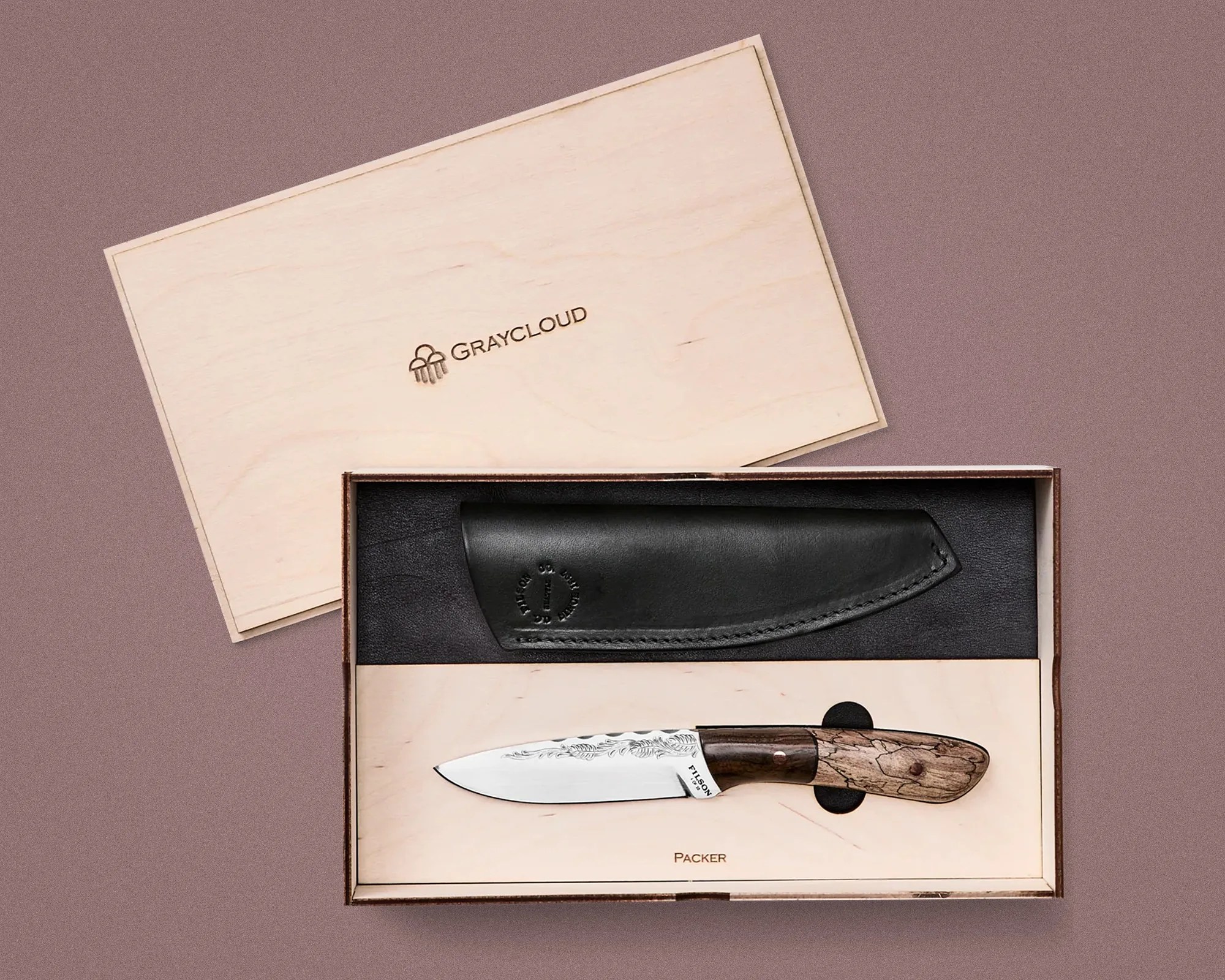 Wooden box with Graycloud logo containing a knife with a patterned steel blade and wooden handle, and a black leather sheath.