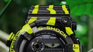 Close-up of a black and yellow Casio G-Shock watch face with digital and analog displays.