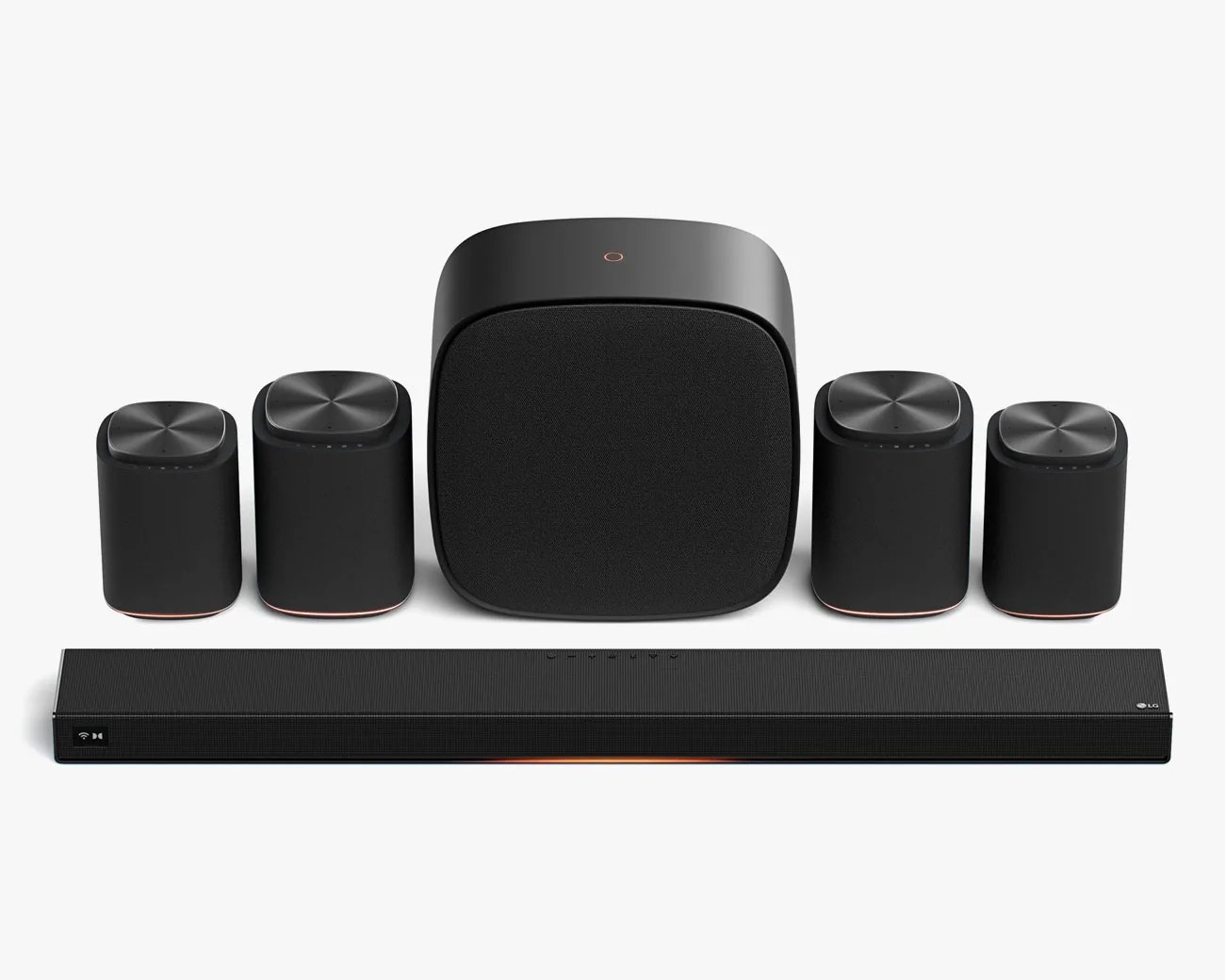 Black LG soundbar system with four satellite speakers and a subwoofer on a white background.